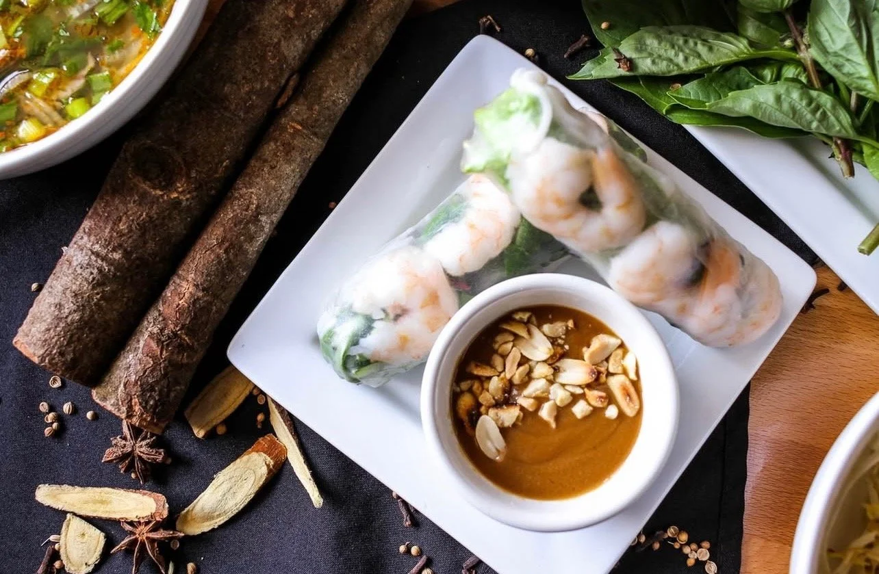 Spring rolls with peanut dipping sauce.