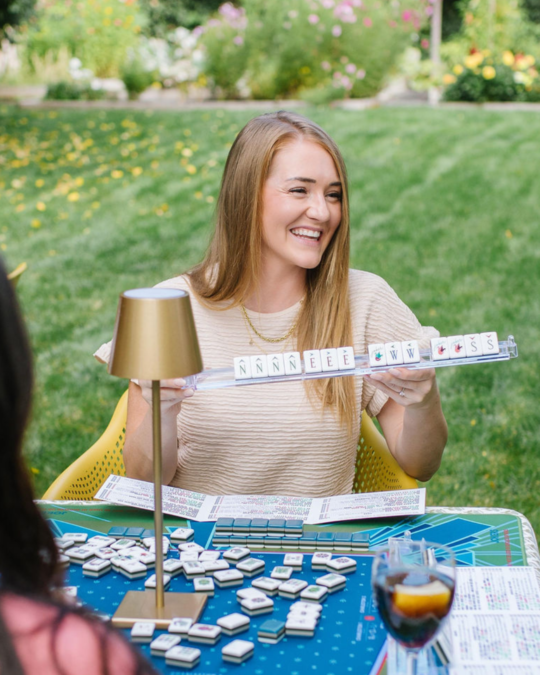 Woman playing American Mahjong at Salt Lake Mahjong Club event