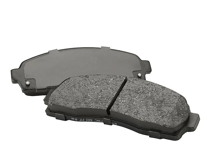 A pair of car brake pads, one with visible brake pad material and the other showing the backing plate, isolated on a white background.