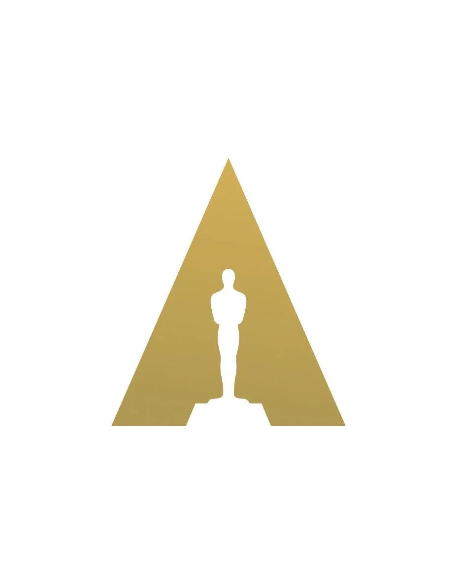 Golden Oscar statuette inside a gold triangle with a white background.