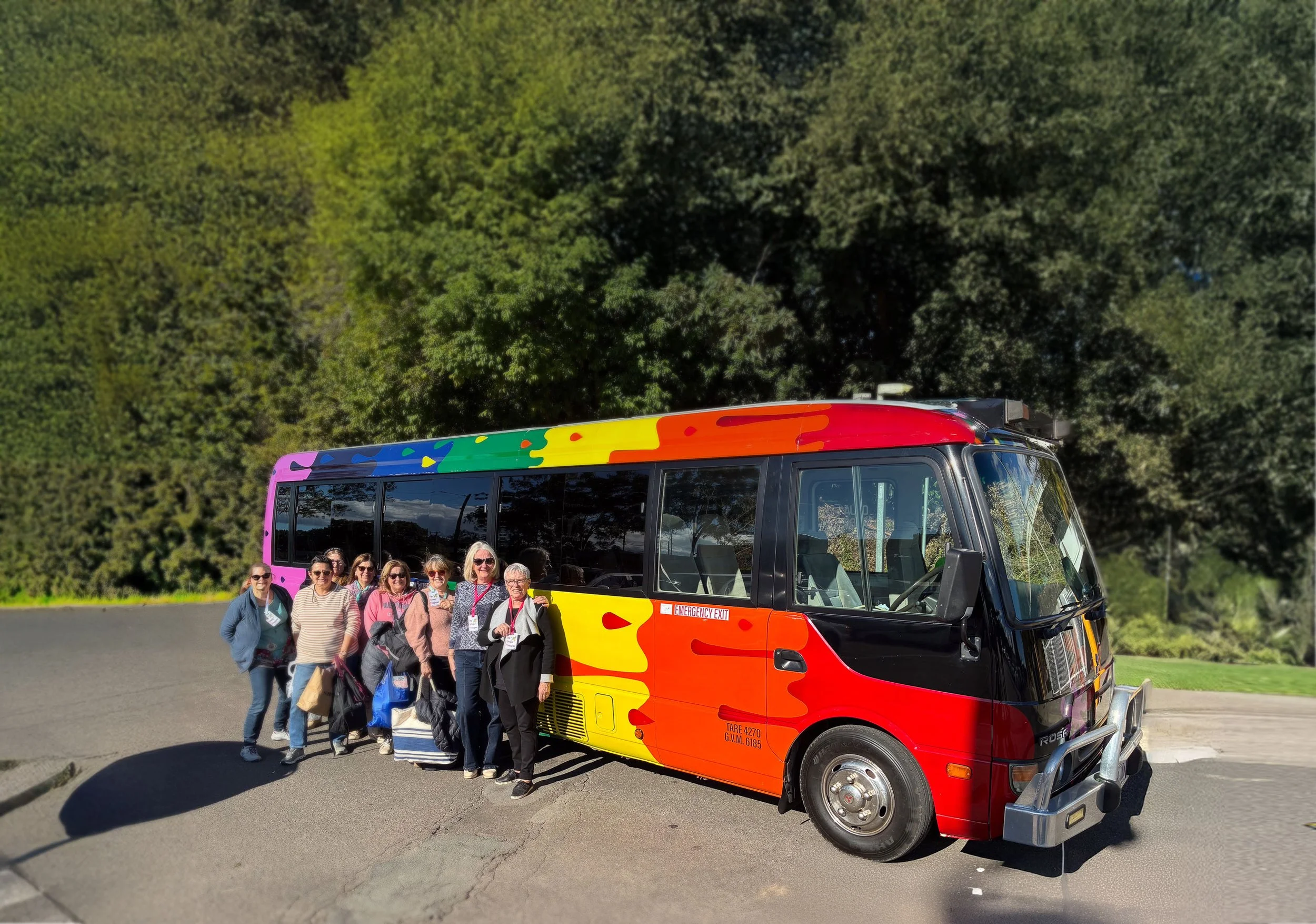 People standing in front bus