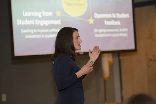 A higher education speaker presenting to an audience