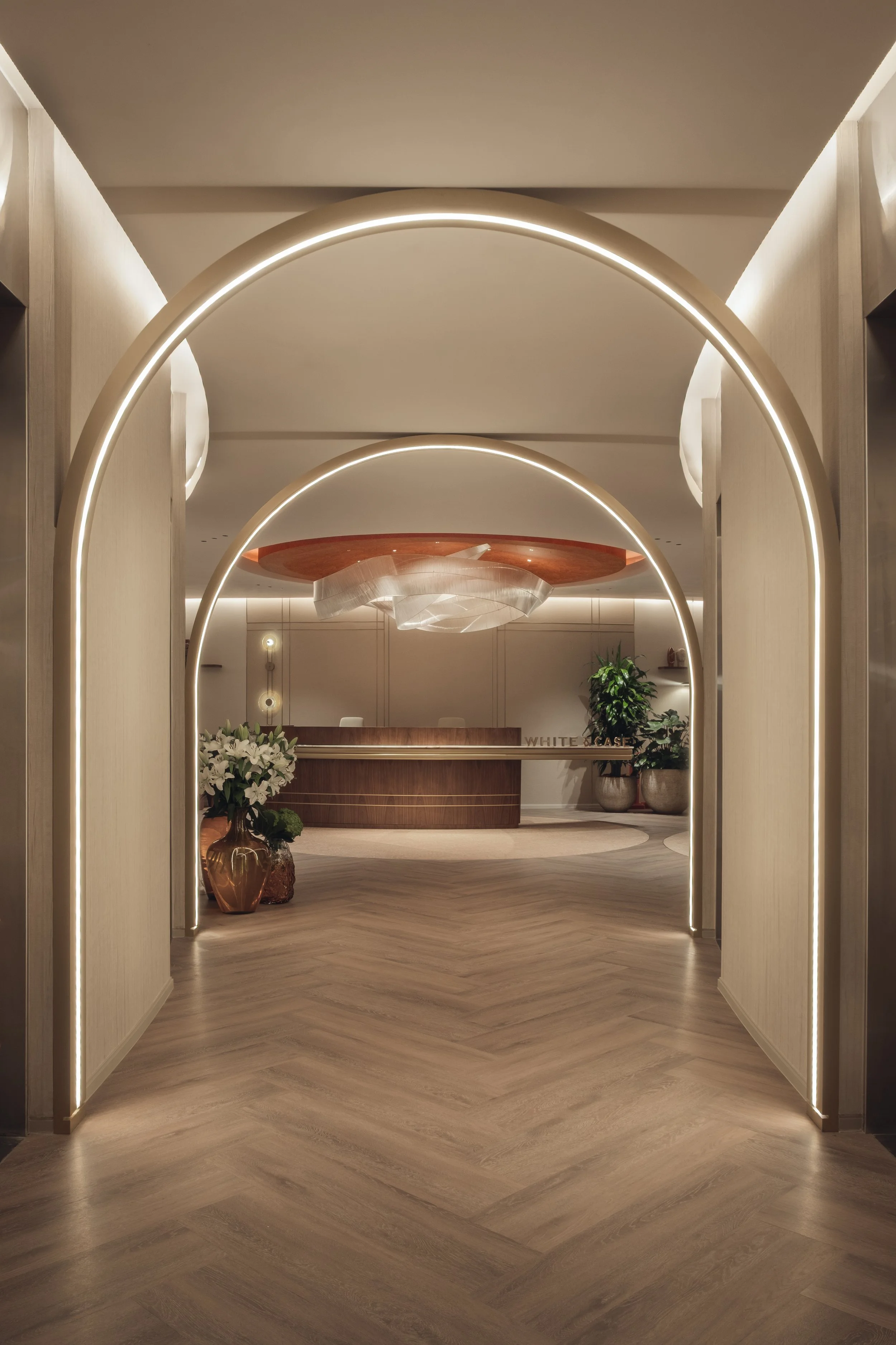 Arched corridor leading to the reception at the White & Case office in Tornado Tower Doha photographed by architectural interior photographer Pedro Ferr