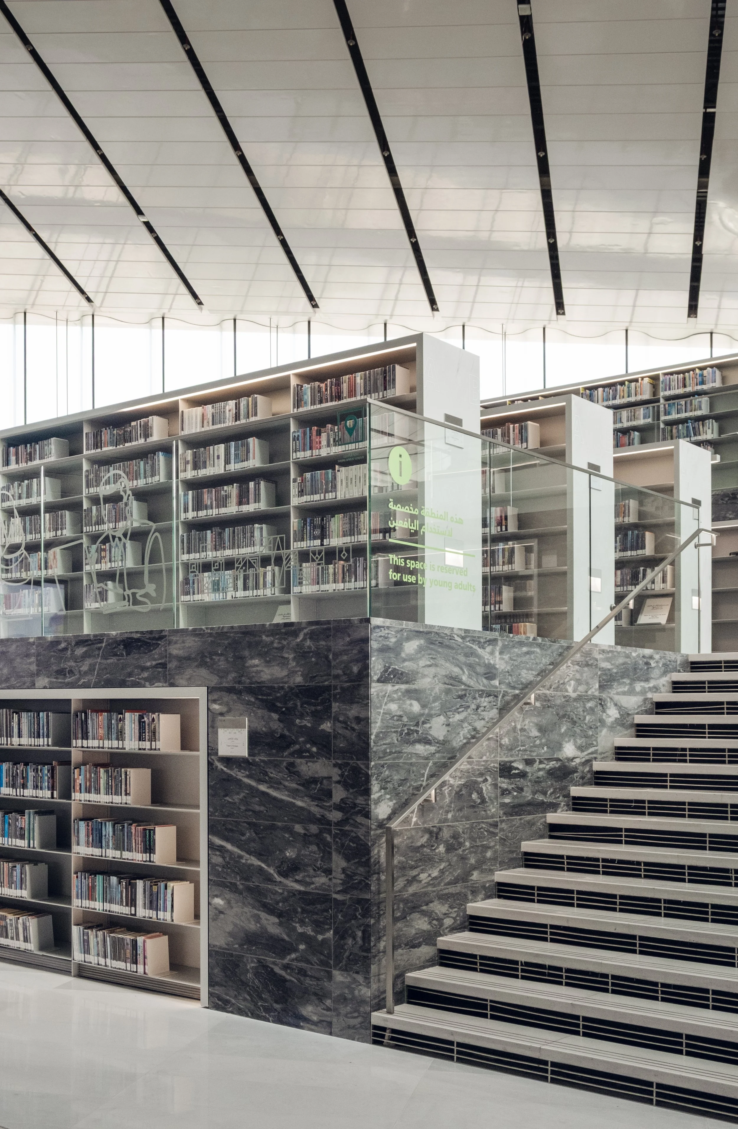 qatar-national-library-interior-staircase-bookshelves-natural-light-doha