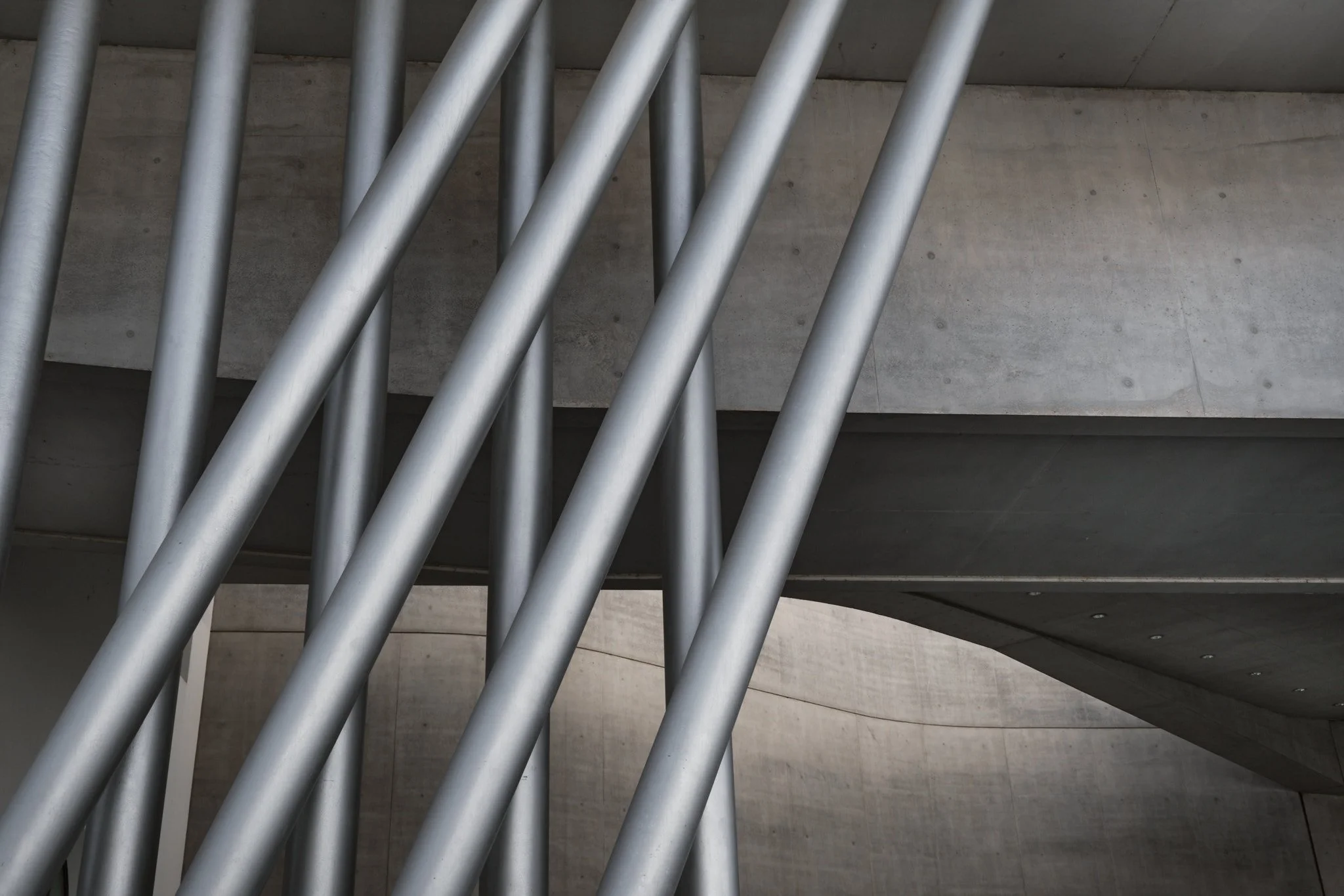 Abstract black and white close-up of diagonal structural steel elements at MAXXI Rome, read as pure graphic form.