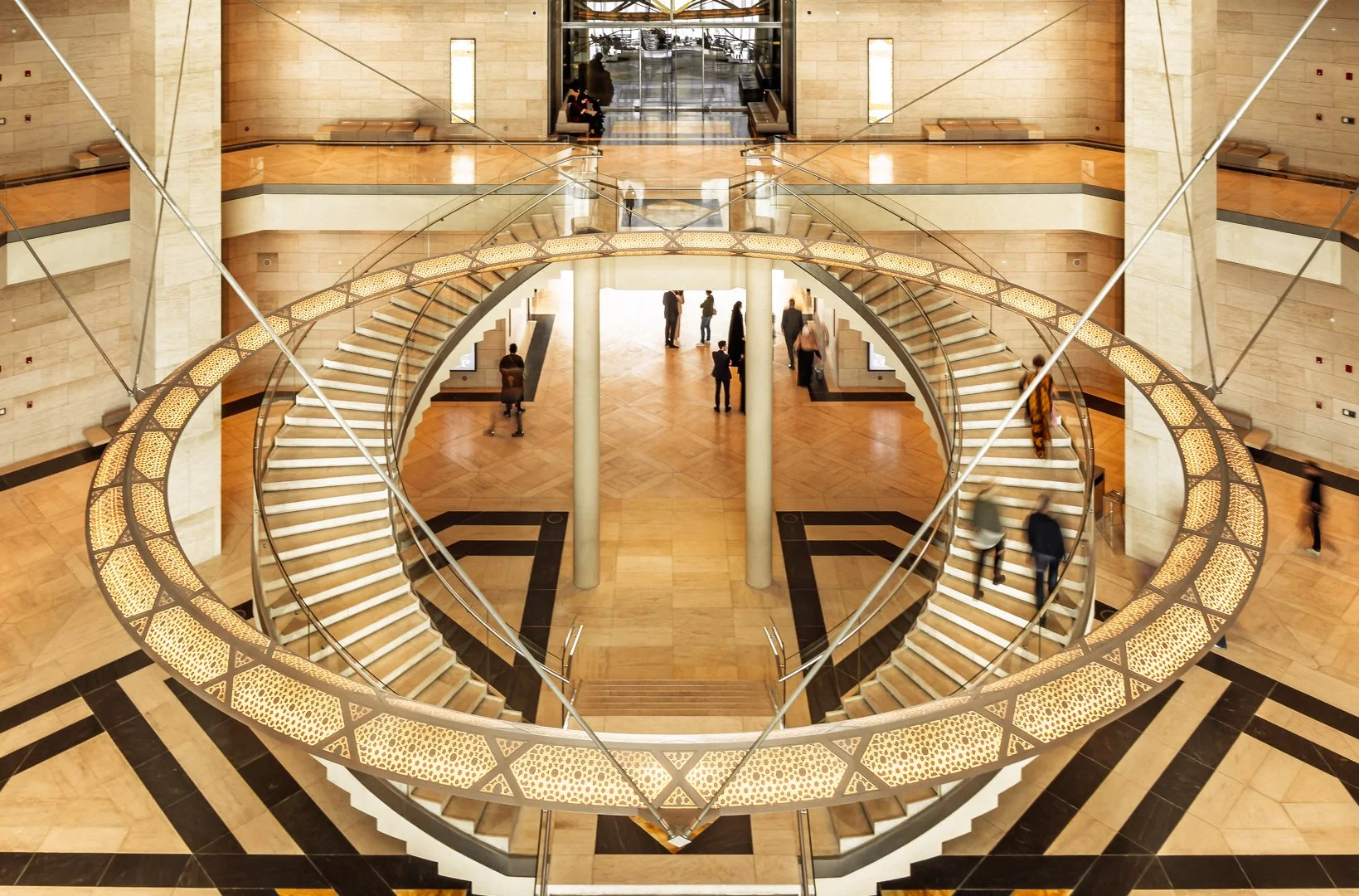 Museum of Islamic Art interior with circular staircase and patterned stone — premium interior geometry