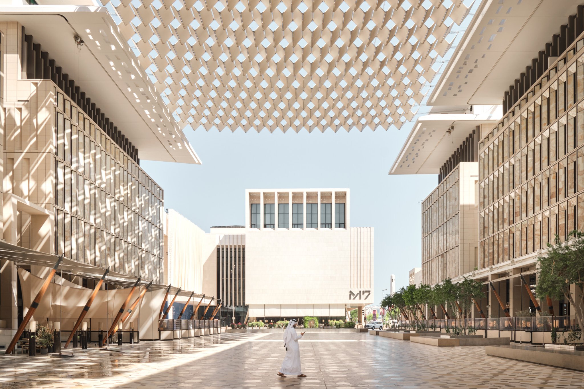 Msheireb Downtown Doha — covered pedestrian street with latticed canopy and stone facades. Architectural photography by Pedro Ferr.