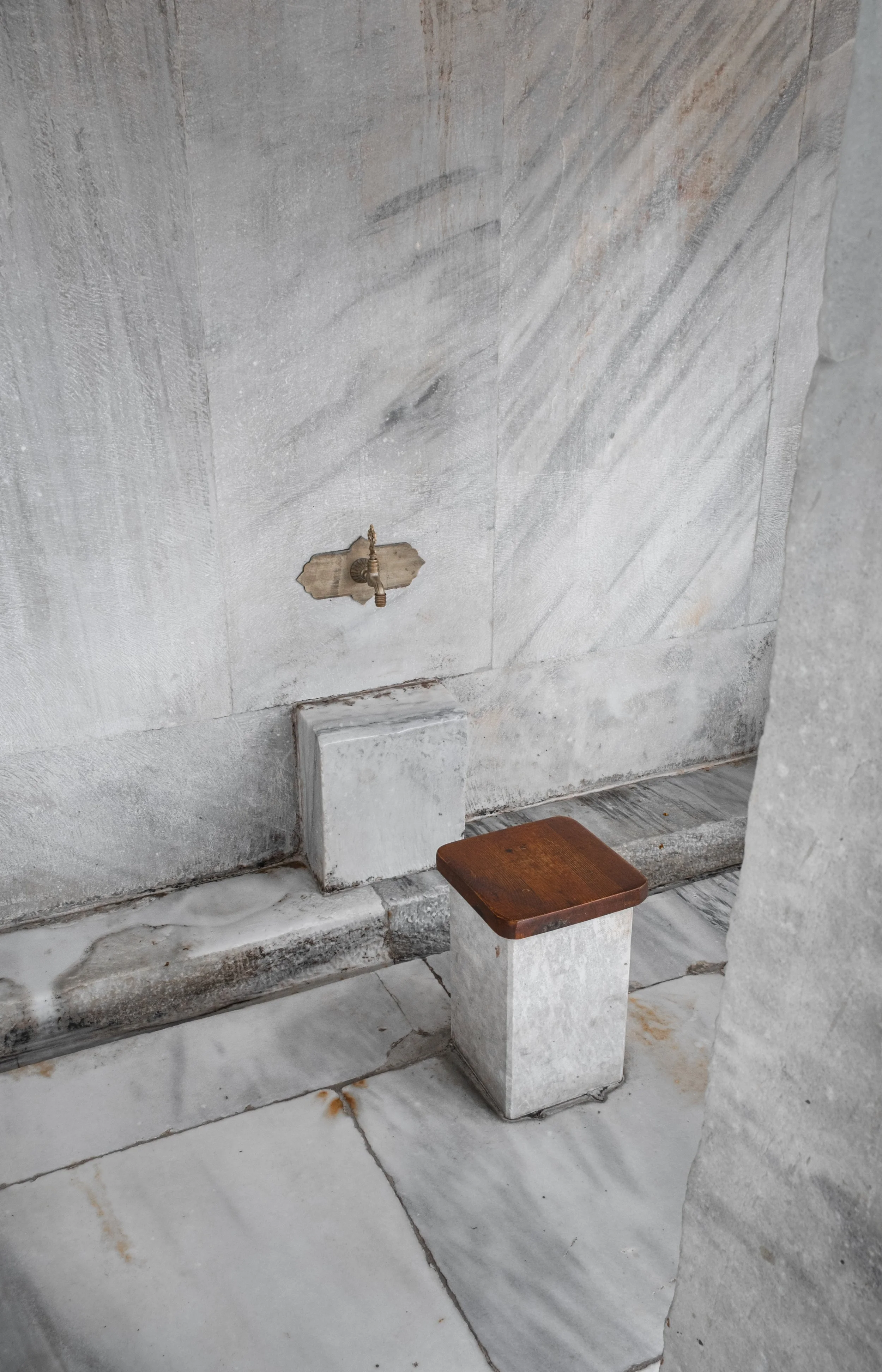 Marble ablution area detail with water spout inside the Blue Mosque in Istanbul.