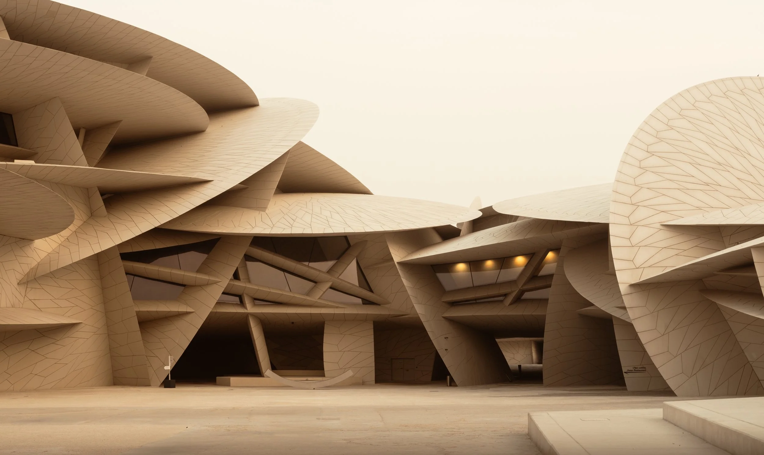 Exterior view of the National Museum of Qatar in Doha, designed by Jean Nouvel, featuring interlocking sand-colored discs inspired by desert rose formations and illuminated by warm desert light.