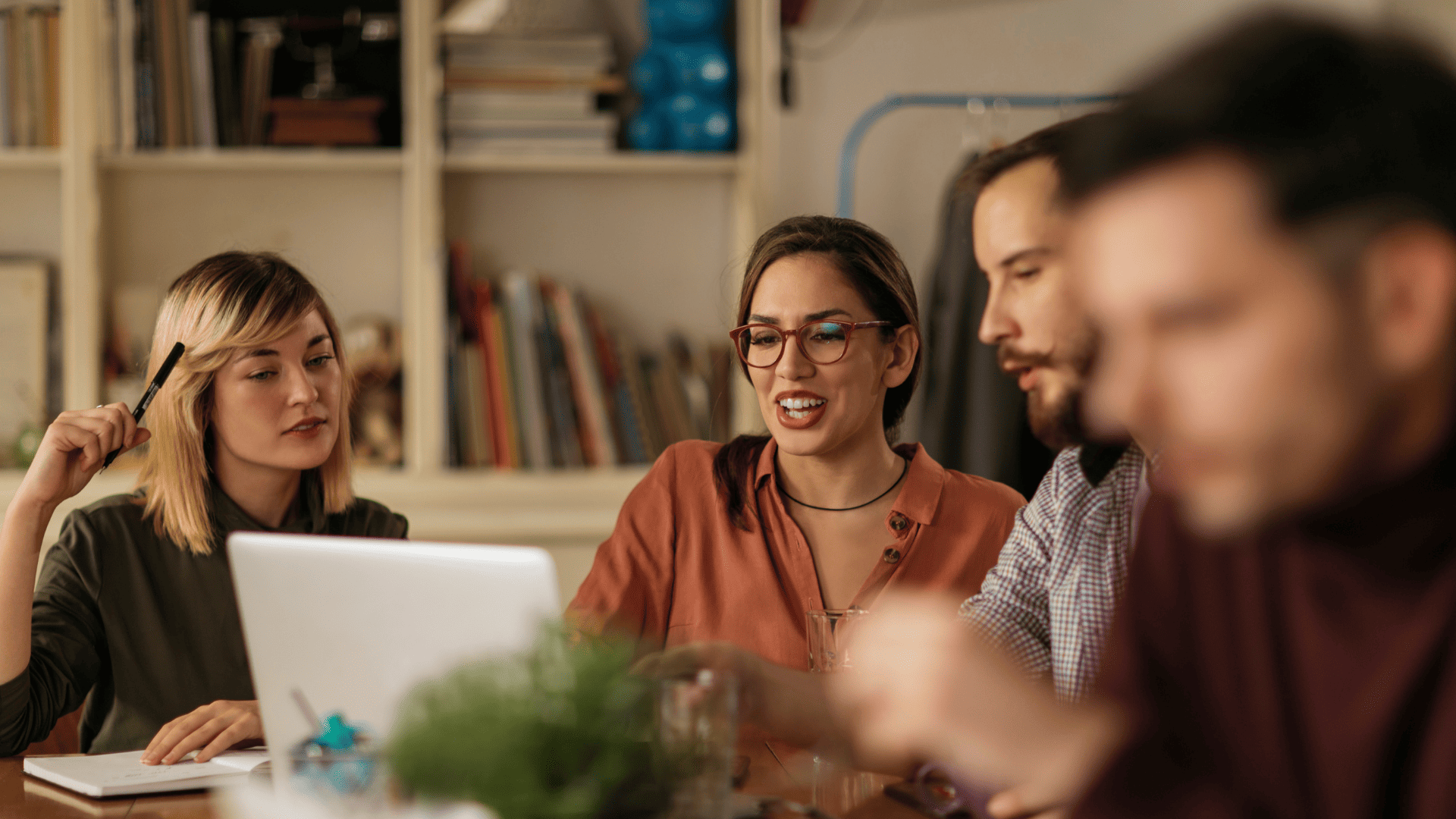 Group of therapists laughing and brainstorming together, symbolizing community, collaboration, and support in the Therapy Business Circle.