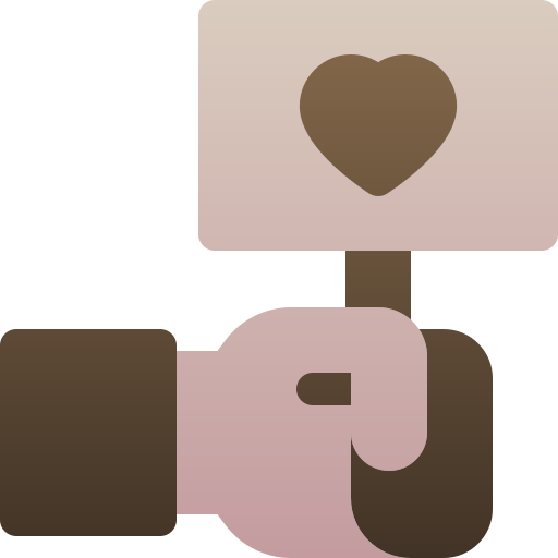 A hand holding a cardboard sign with a heart symbol.