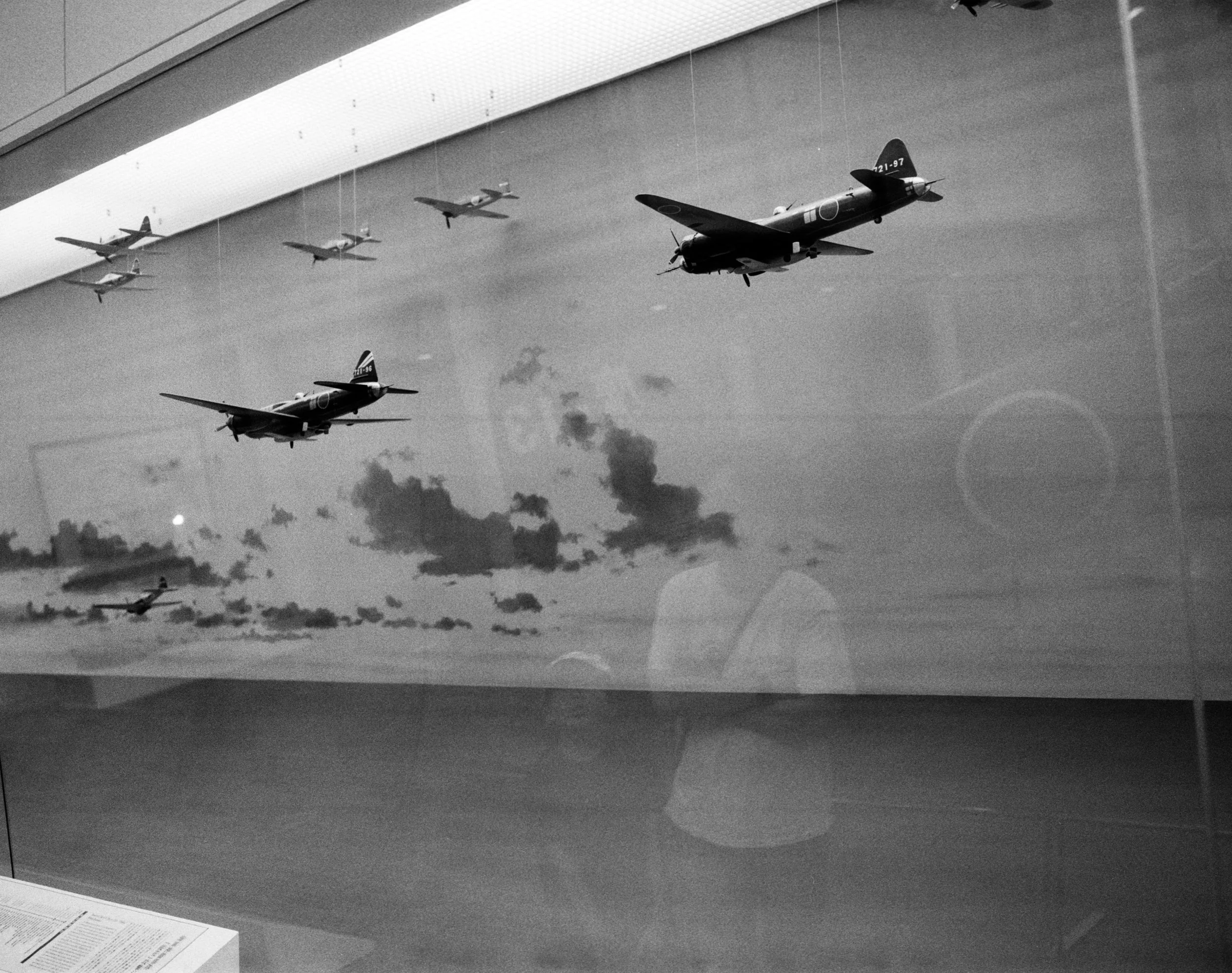 Father and son look at a diorama of Japanese light bombers, Yushukan Museum, Yasukuni Jinja, Tokyo, Japan, 2025