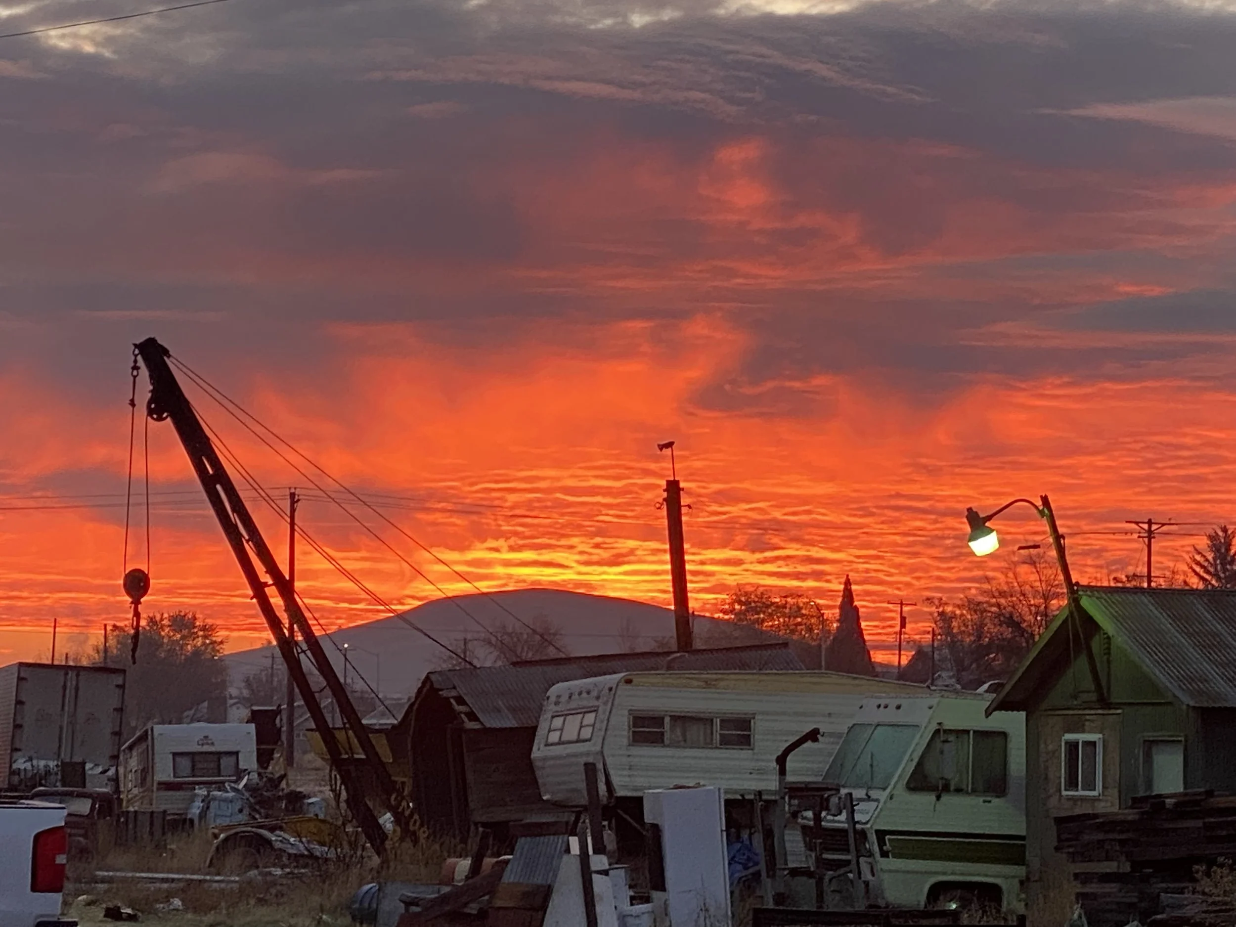 Sunrise over large property needing Junk Removal