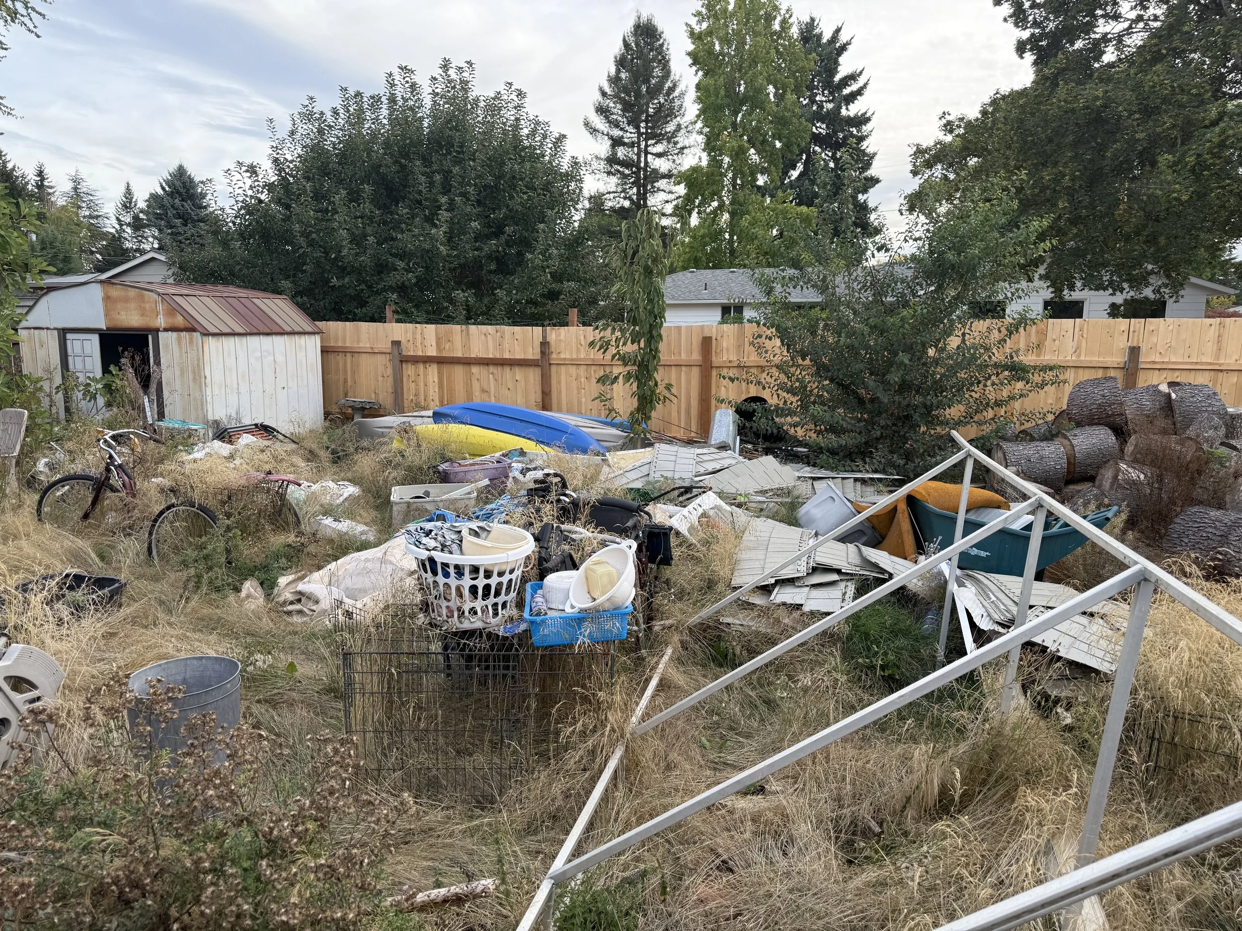 Back yard of hoarder property clean out Beaverton, OR.