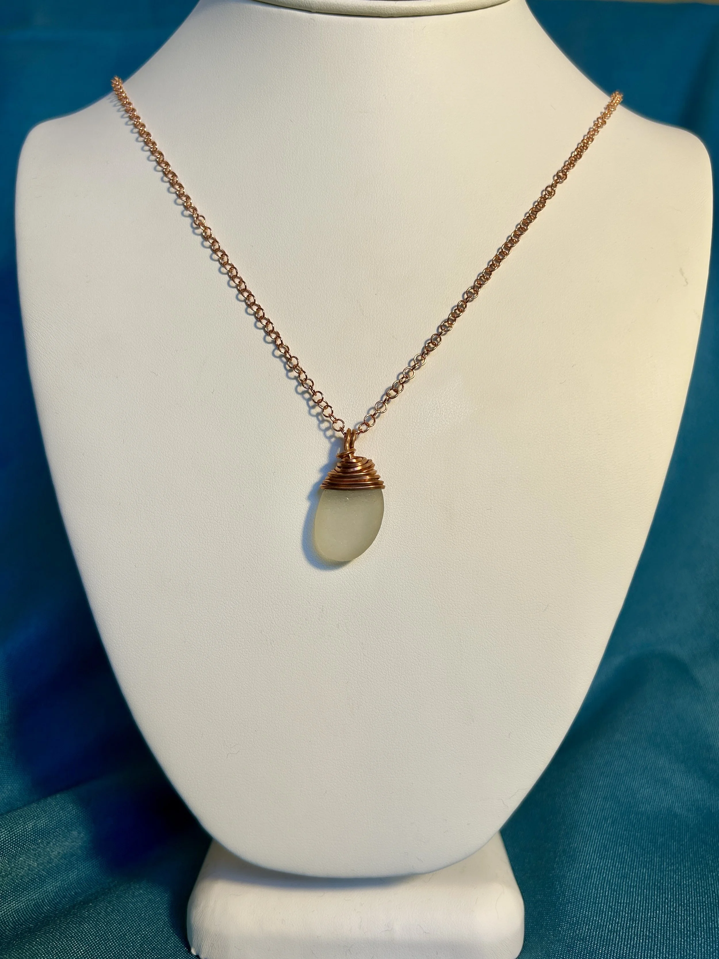 Copper wrapped clear pendant