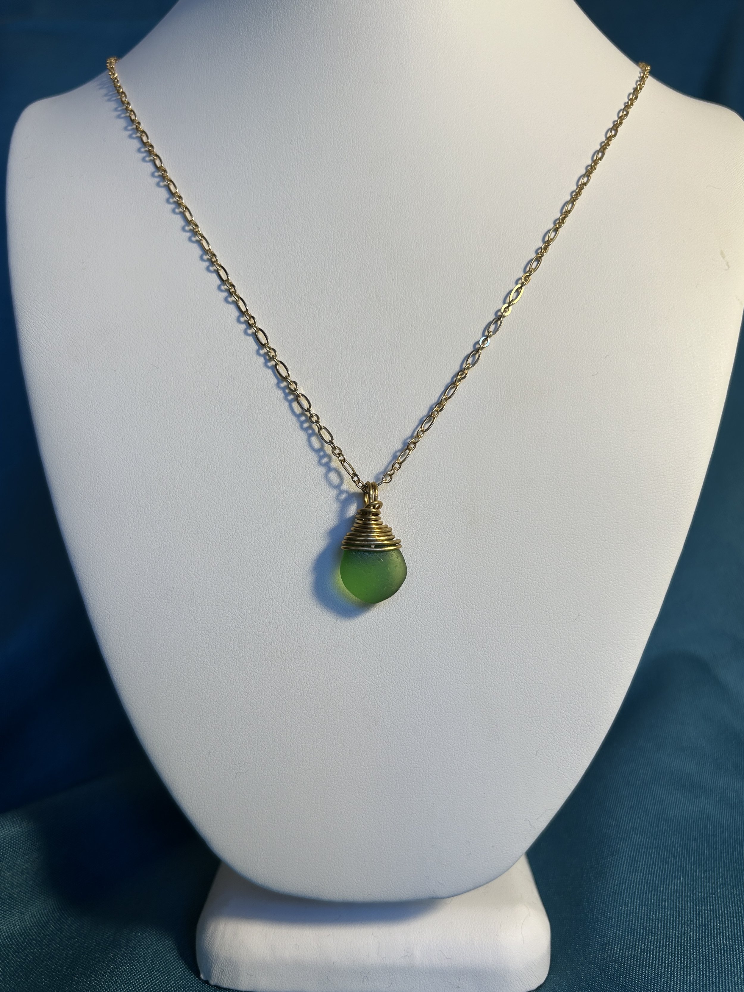 Brass wrapped green pendant