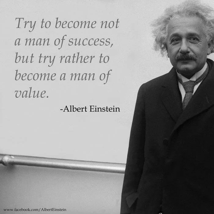 A black-and-white photo of Albert Einstein standing next to a quote that reads, "Try to become not a man of success, but try rather to become a man of value."
