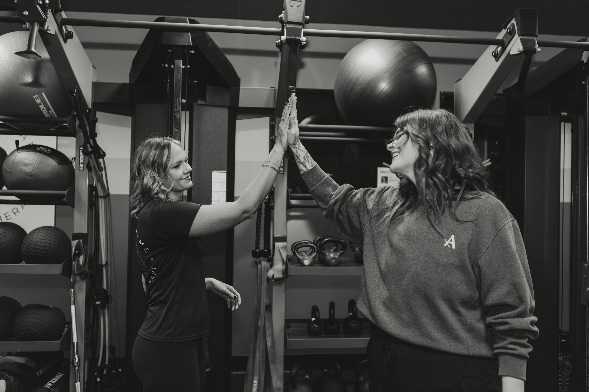 Dr. BettyLou DeYoung working one-on-one with a patient during a physical therapy session at Rise & Reframe PT in Temecula, CA — personalized strength and functional movement training