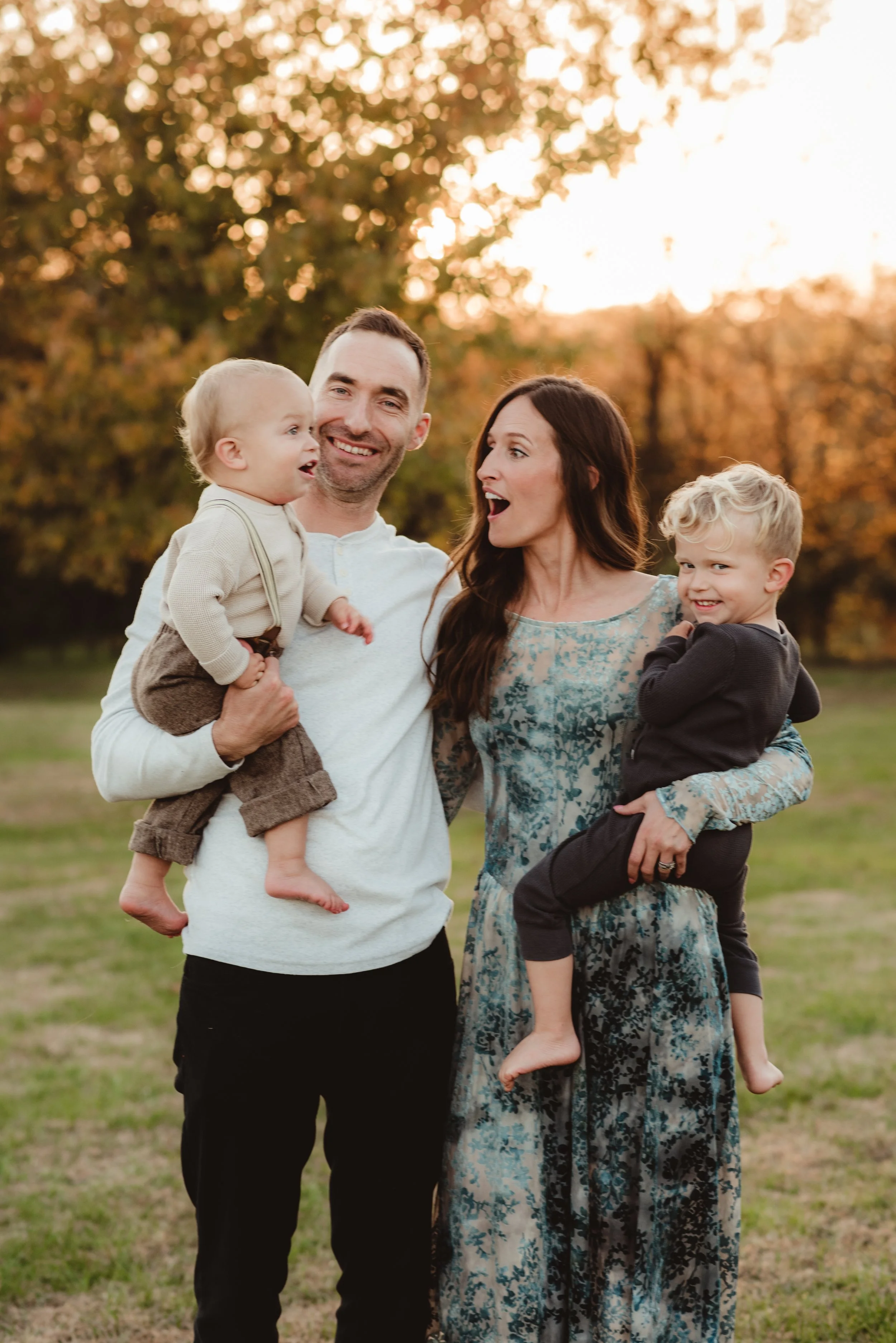 Family of four photographed outdoors at sunset during a family photography session in Middle Tennessee.