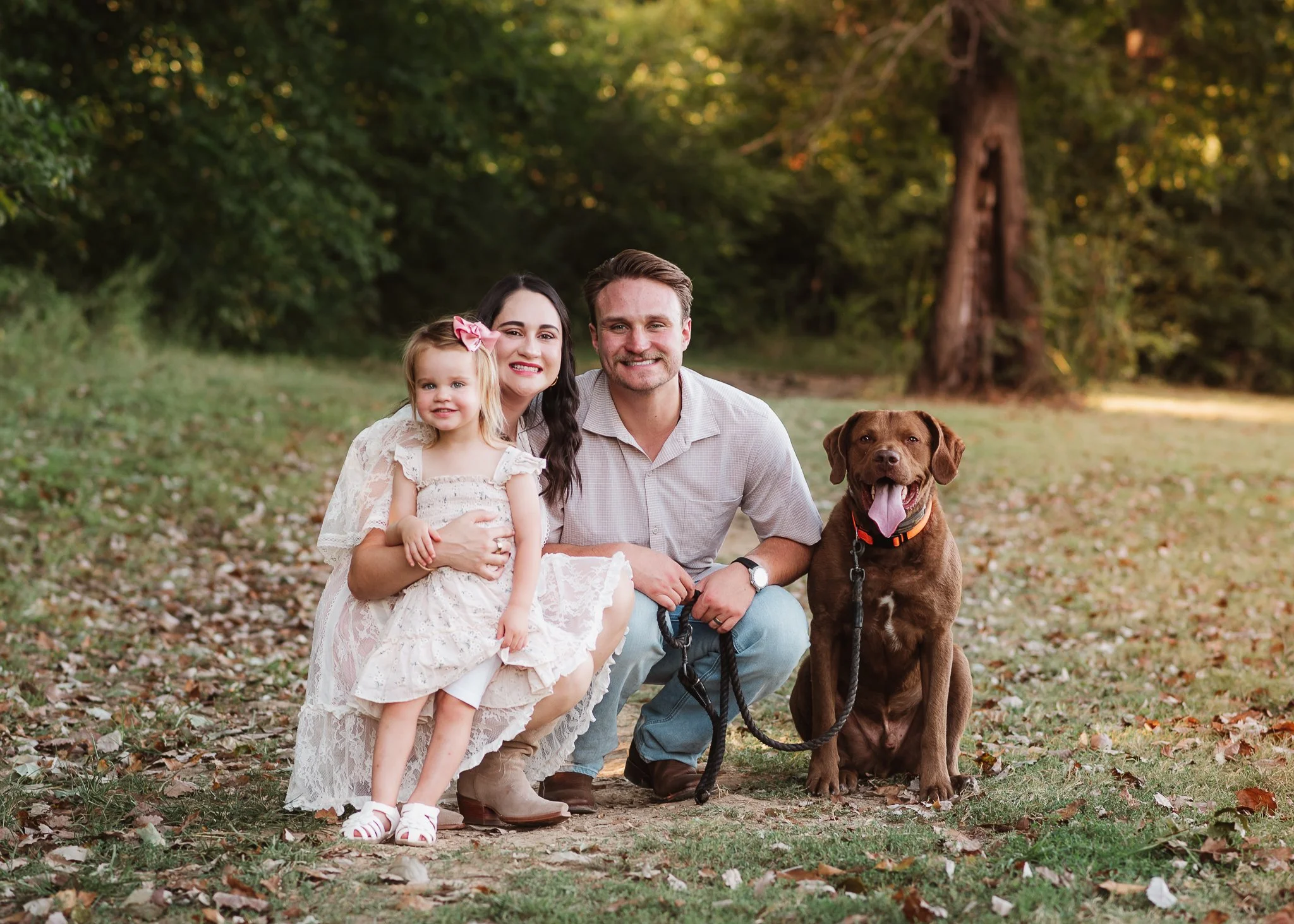 Family with their young daughter and dog during an outdoor family photography session in Nashville.
