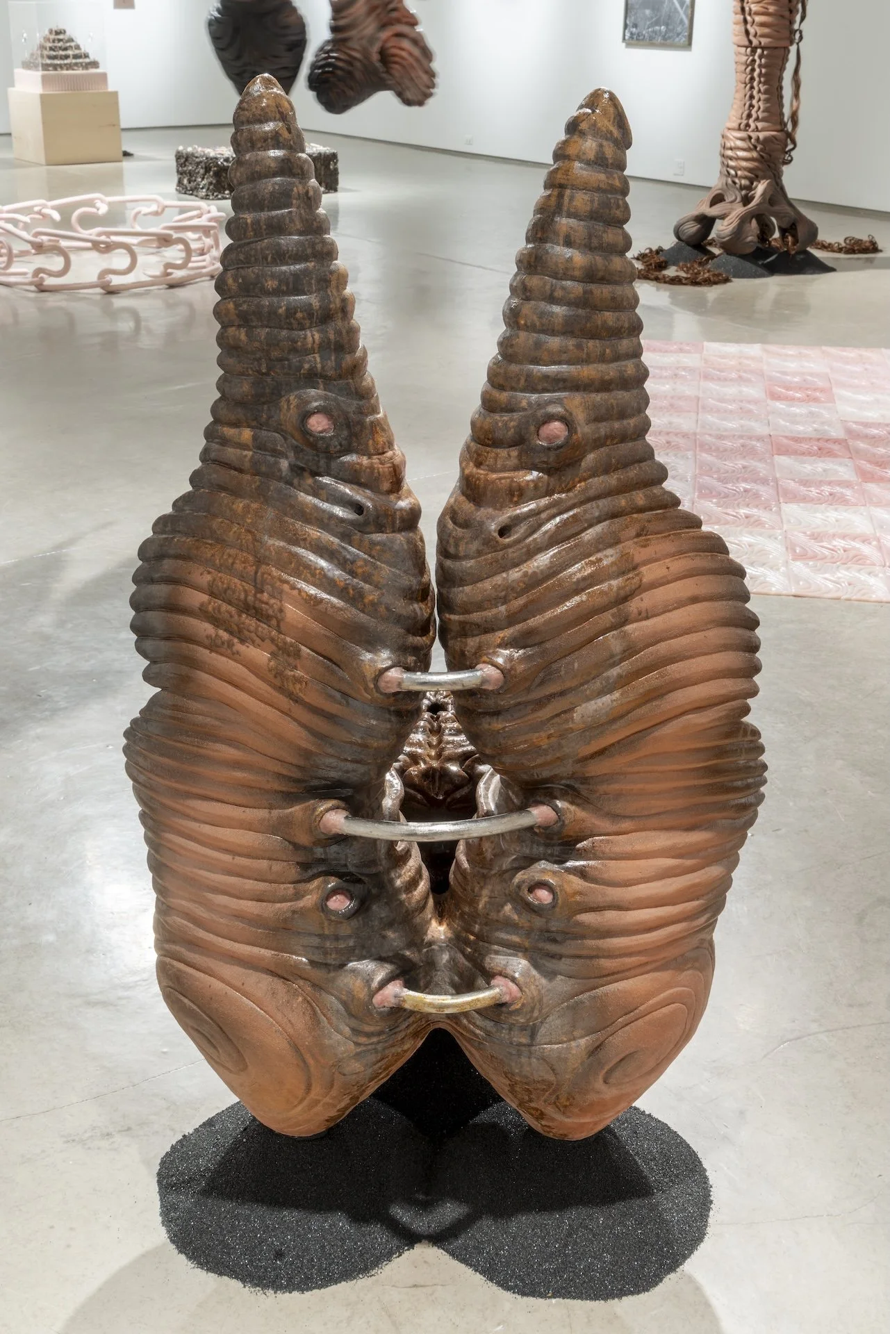 Back view of: Twisted wings, 2025. Ceramic, steel, silicone and sand blasting medium. 54 x 32 x 32 in.