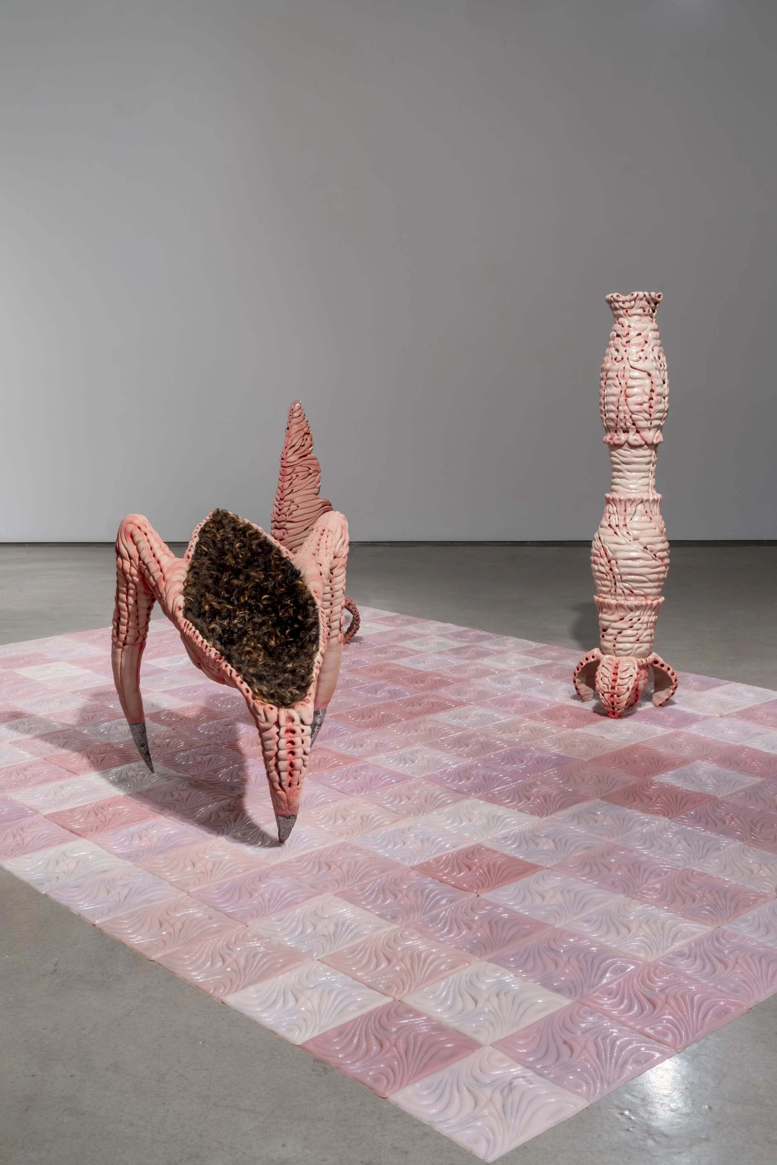Installation view of: ant/i/bodies, 2025.
Ceramic, silicone, human hair, cast aluminum.
Various dimensions.