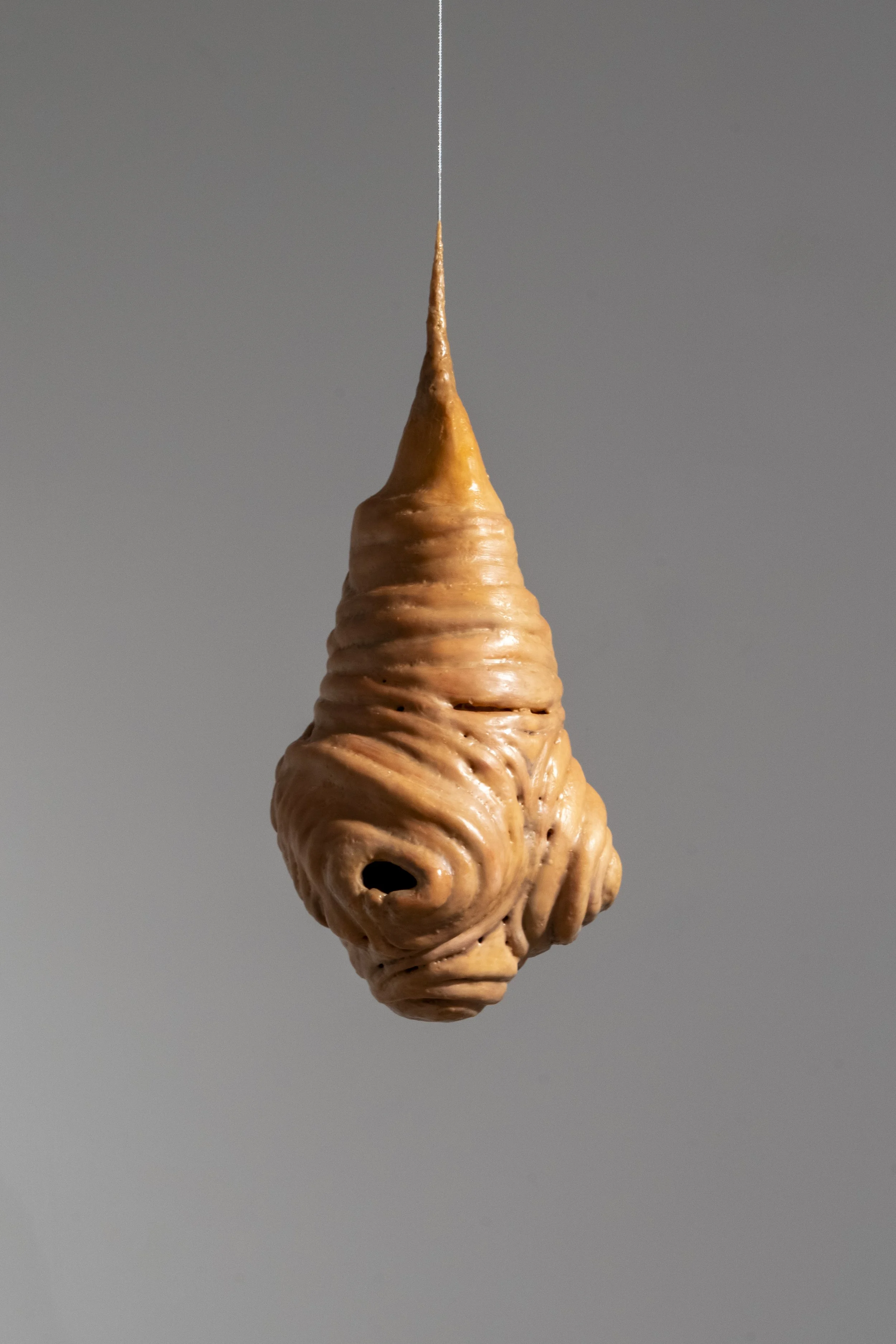 Quarry, 2025. Ceramic, beeswax and cable wire. 24 x 14 x 10 in.