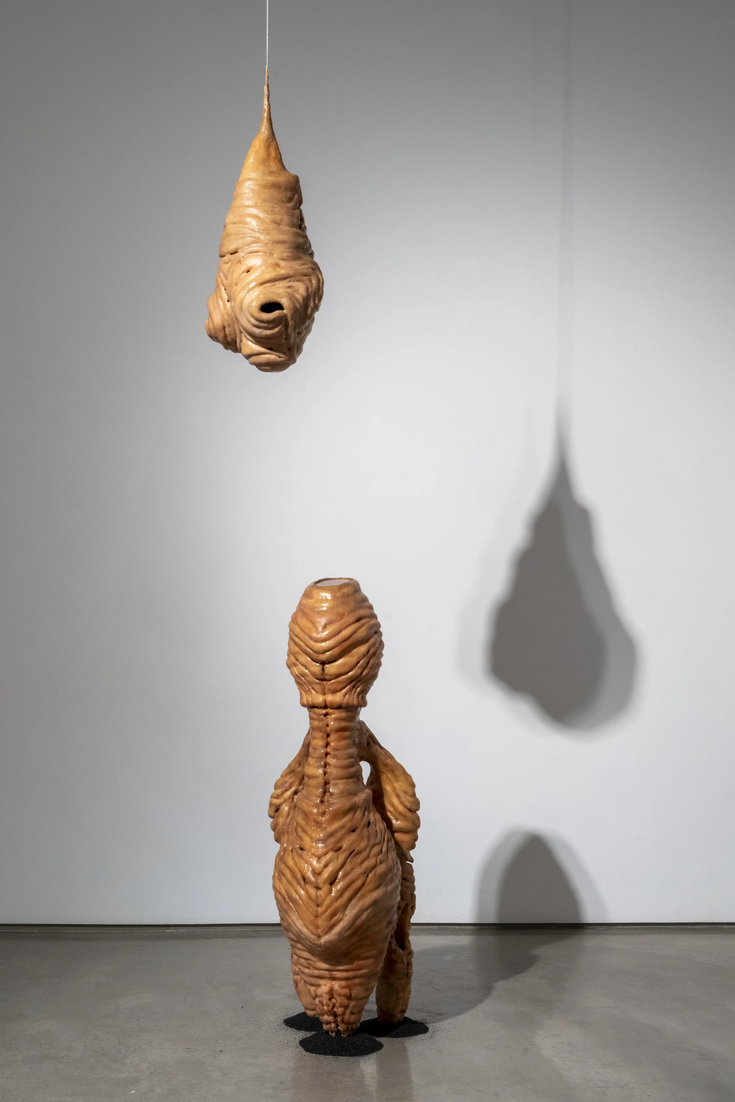 Installation view of: ant/i/bodies, 2025. Ceramic, beeswax, silicone and sand blasting medium. Various dimensions.