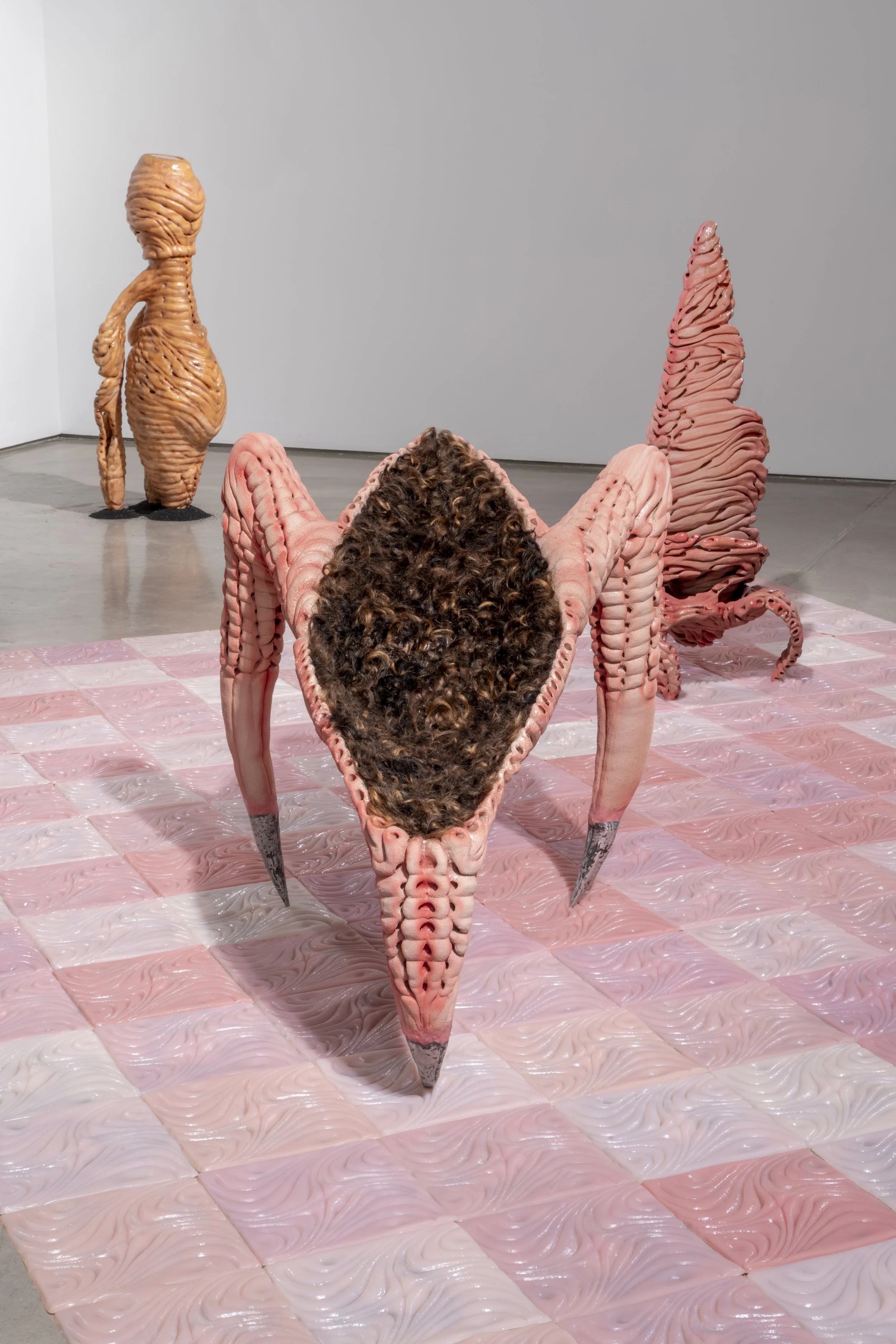 Installation view of: ant/i/bodies, 2025.
Ceramic, silicone, human hair, beeswax, cast aluminum. Various dimensions.