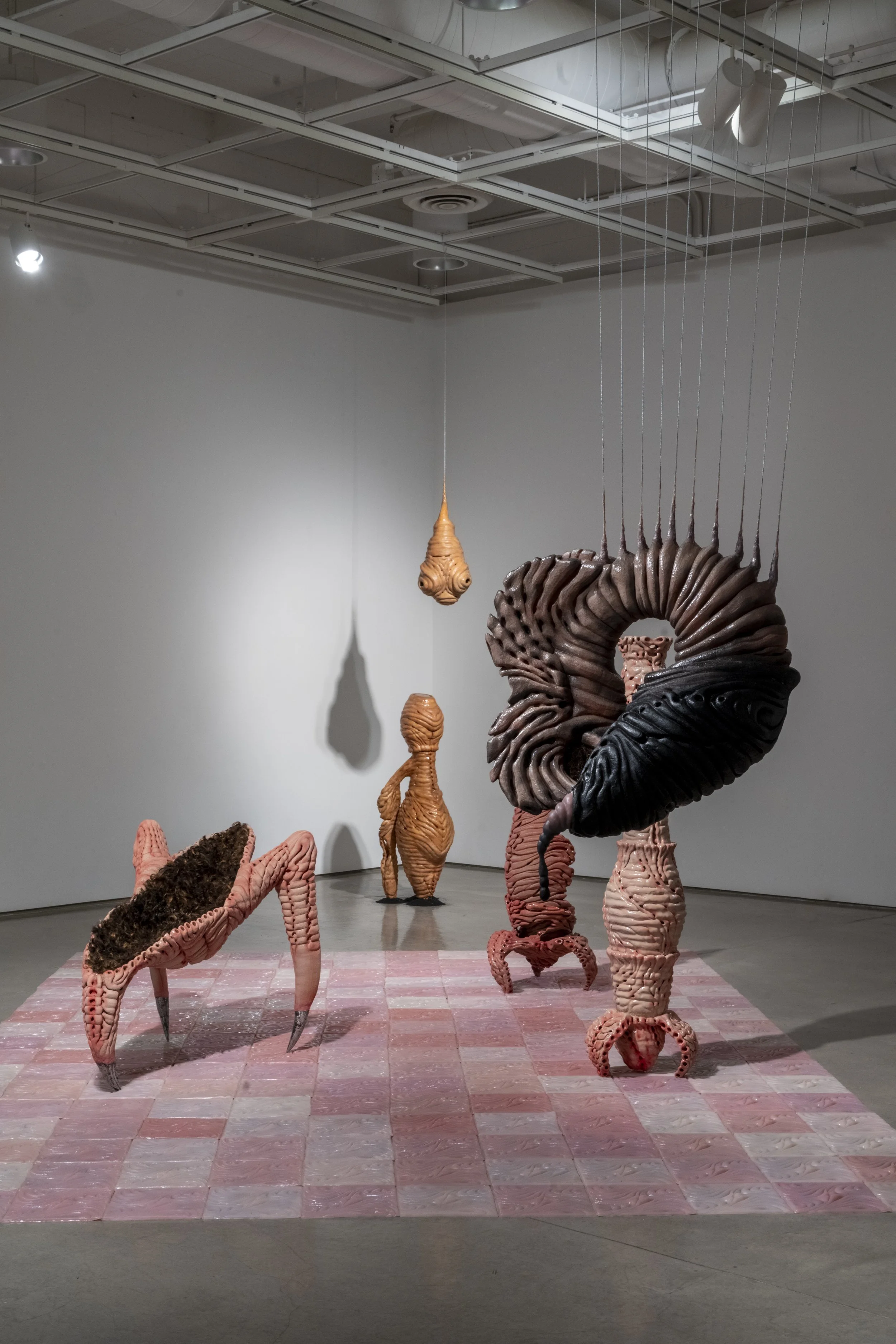 Installation view of: ant/i/bodies, 2025.
Ceramic, silicone, human hair, beeswax, rubber, cast aluminum, sand blasting medium. Various dimensions.