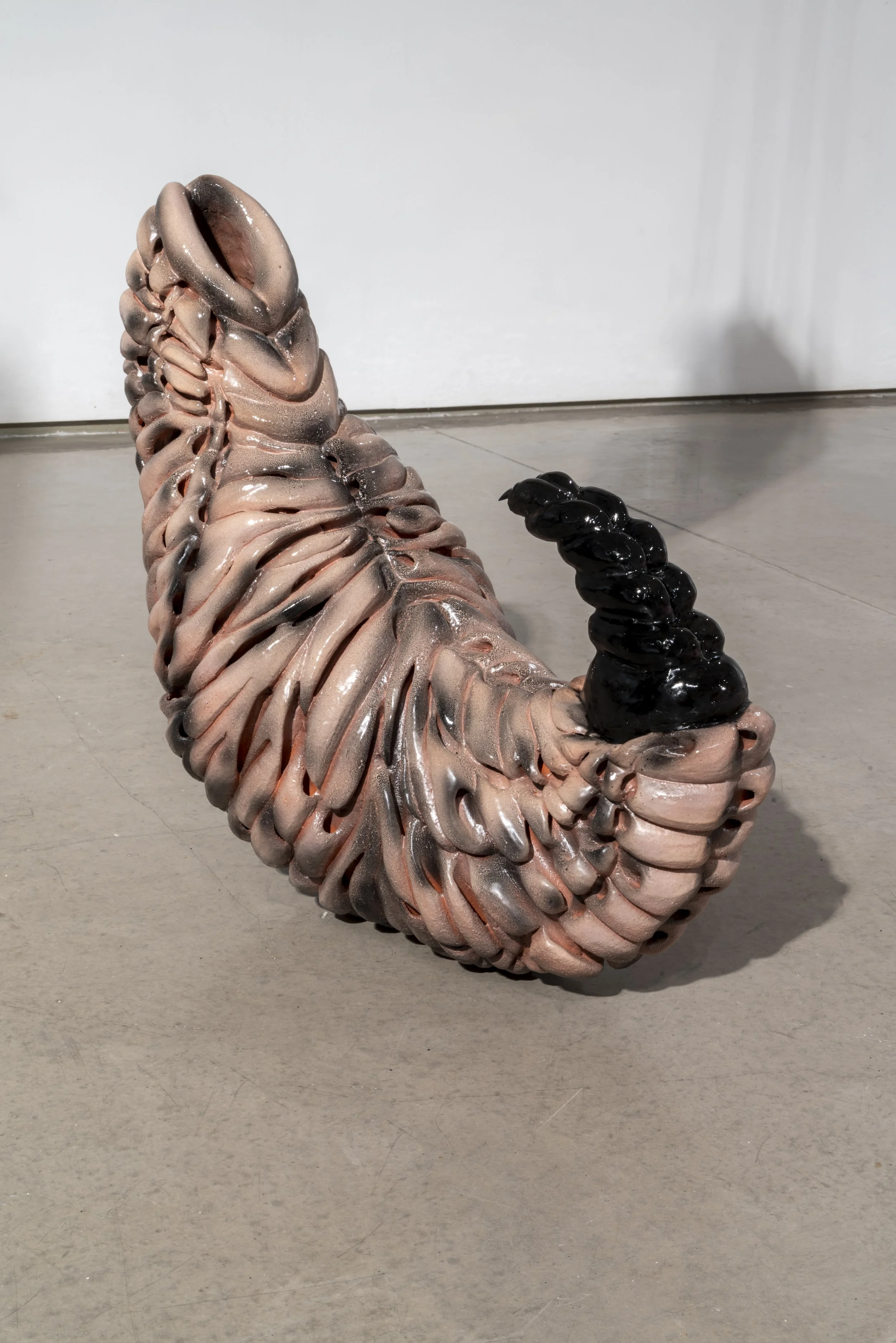 Untitled, 2025. Ceramic, beeswax and acrylic nails. 28 x 22 x 11.5 in.