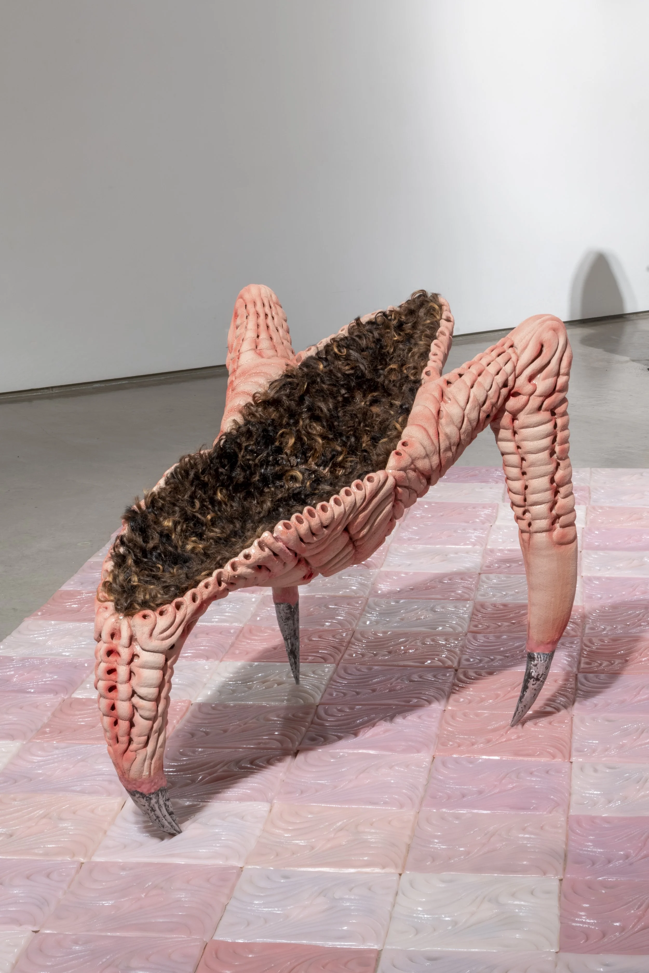 Chair et poil (flesh and fur), 2025. Ceramic, human hair, cast aluminum and fake diamond. 35 x 28 x 44 in.
