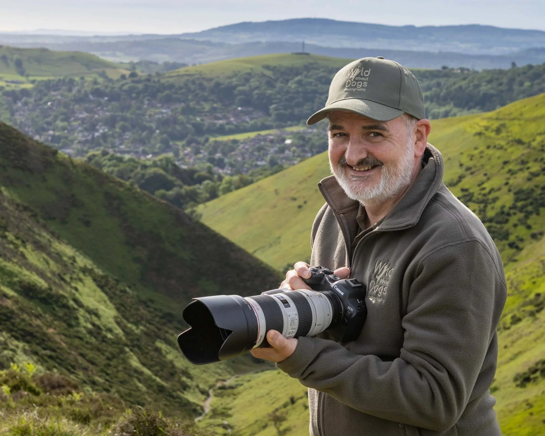Portrait of Mark Evans, wildlife and dog photographer photographed against the hills of the Long Mynd