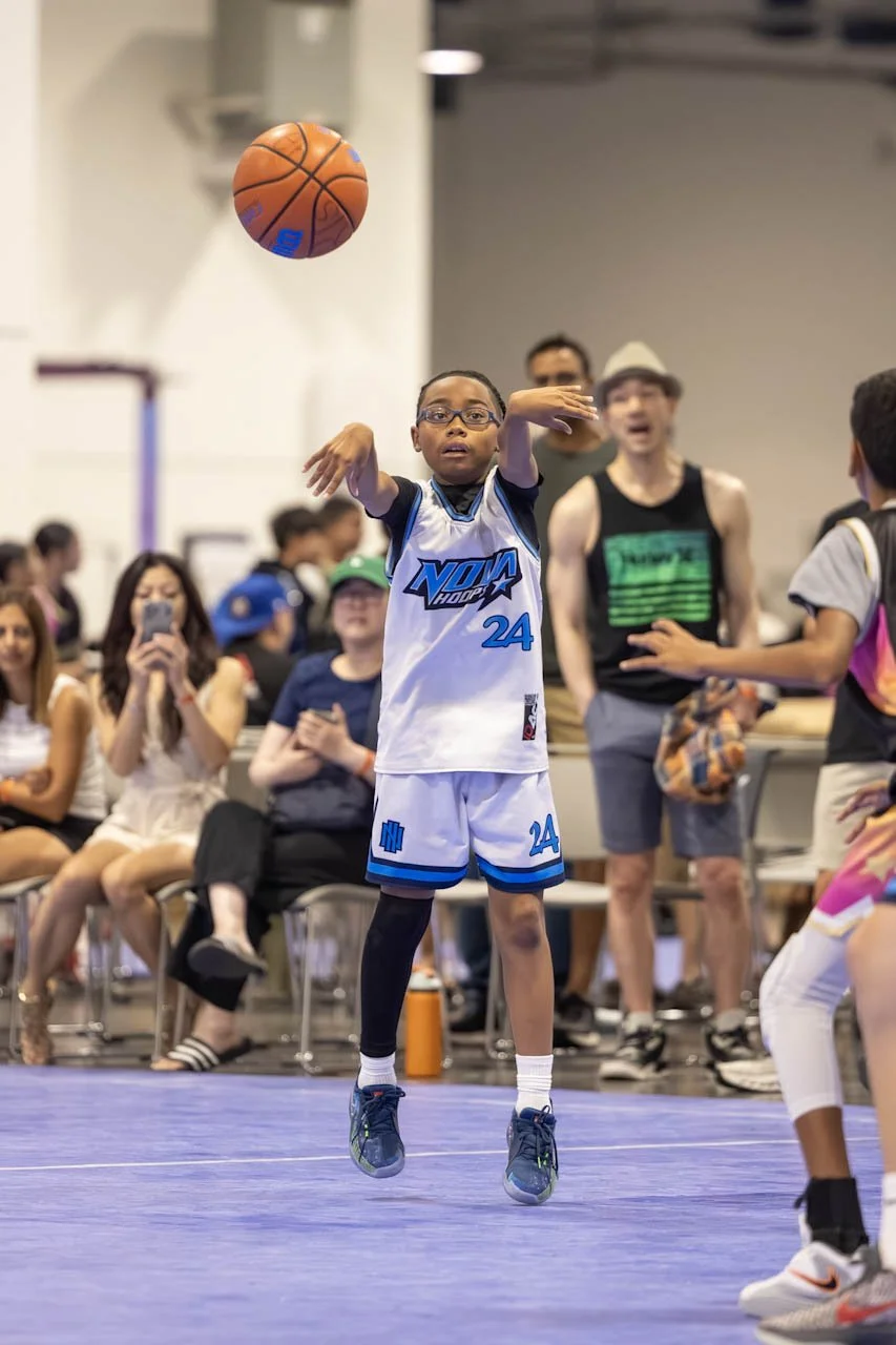 Nova Hoops youth basketball player shooting during tournament competition