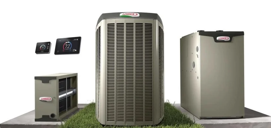 A Lennox heating and cooling system setup, including an air conditioning unit, a furnace, two smart thermostats, and an air handler on a gray platform with grass, against a white background.
