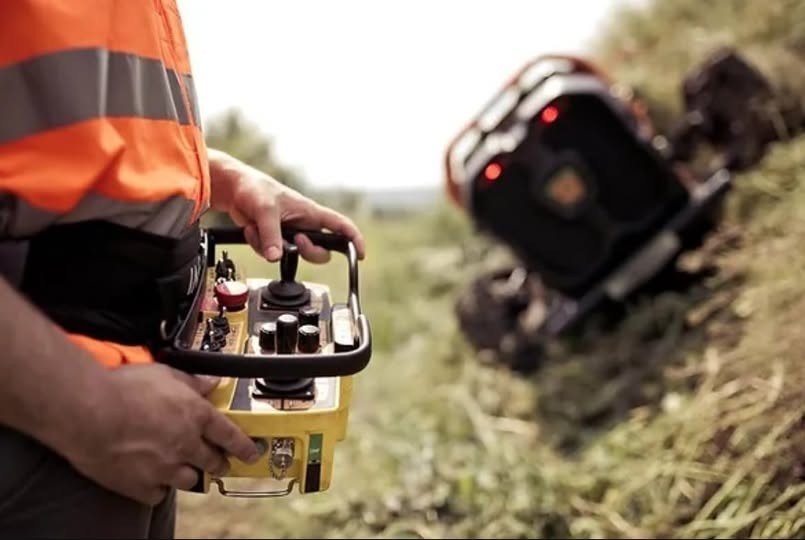 Steep embankment mowing service remote-controlled equipment operator safety Campbell County