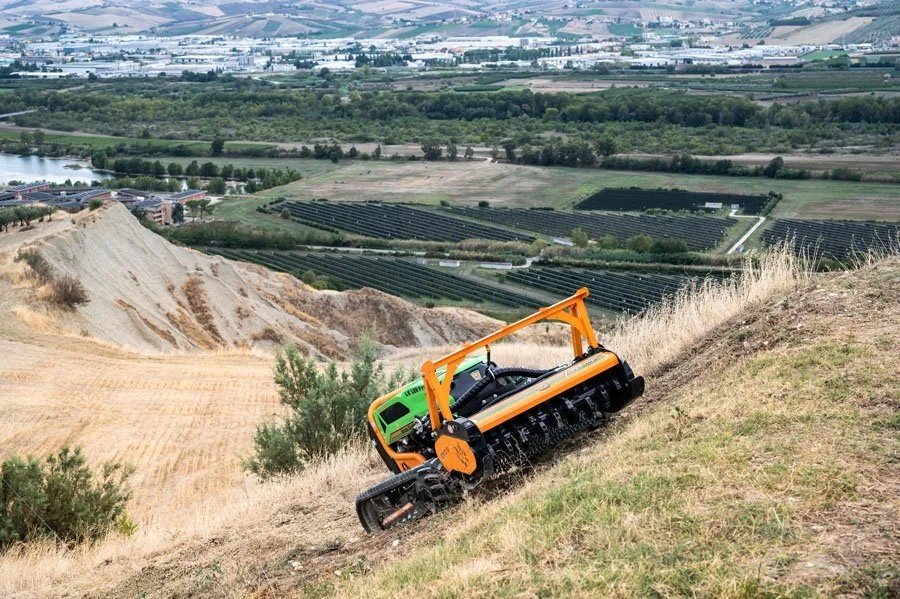 Steep hillside mowing equipment stump grinding attachment land clearing