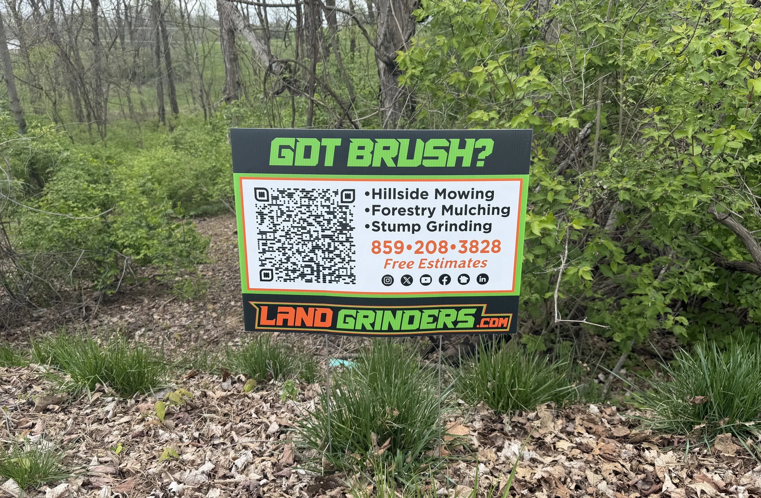 Land Grinders yard sign with QR code for land clearing and forestry mulching services
