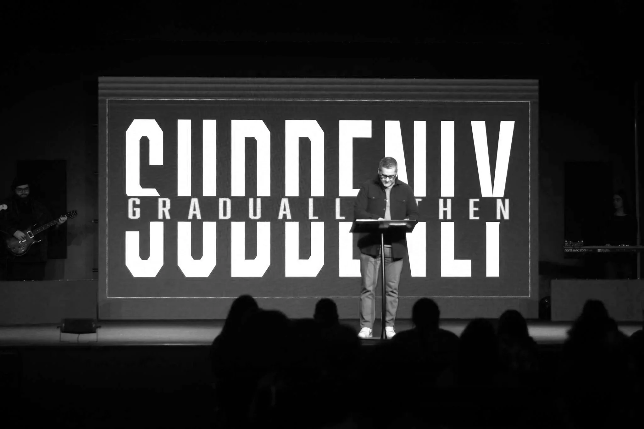 Pastor preaching during a Sunday message at Merge Church