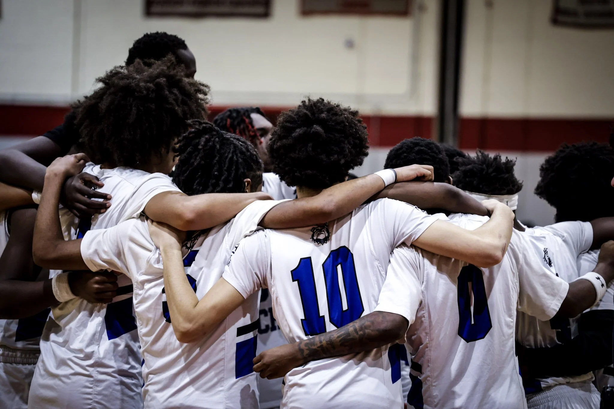 Holland Tech HS boys basketball in huddle