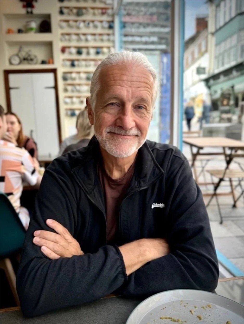 Jeff (USA)
Stirling, Scotland.  

“Relax into it,” Jeff says as he teaches me to meditate in public. An internet security professional retired from the University of California at Berkeley, Jeff set off on a two-year ‘walkabout’ of self-discovery. I 