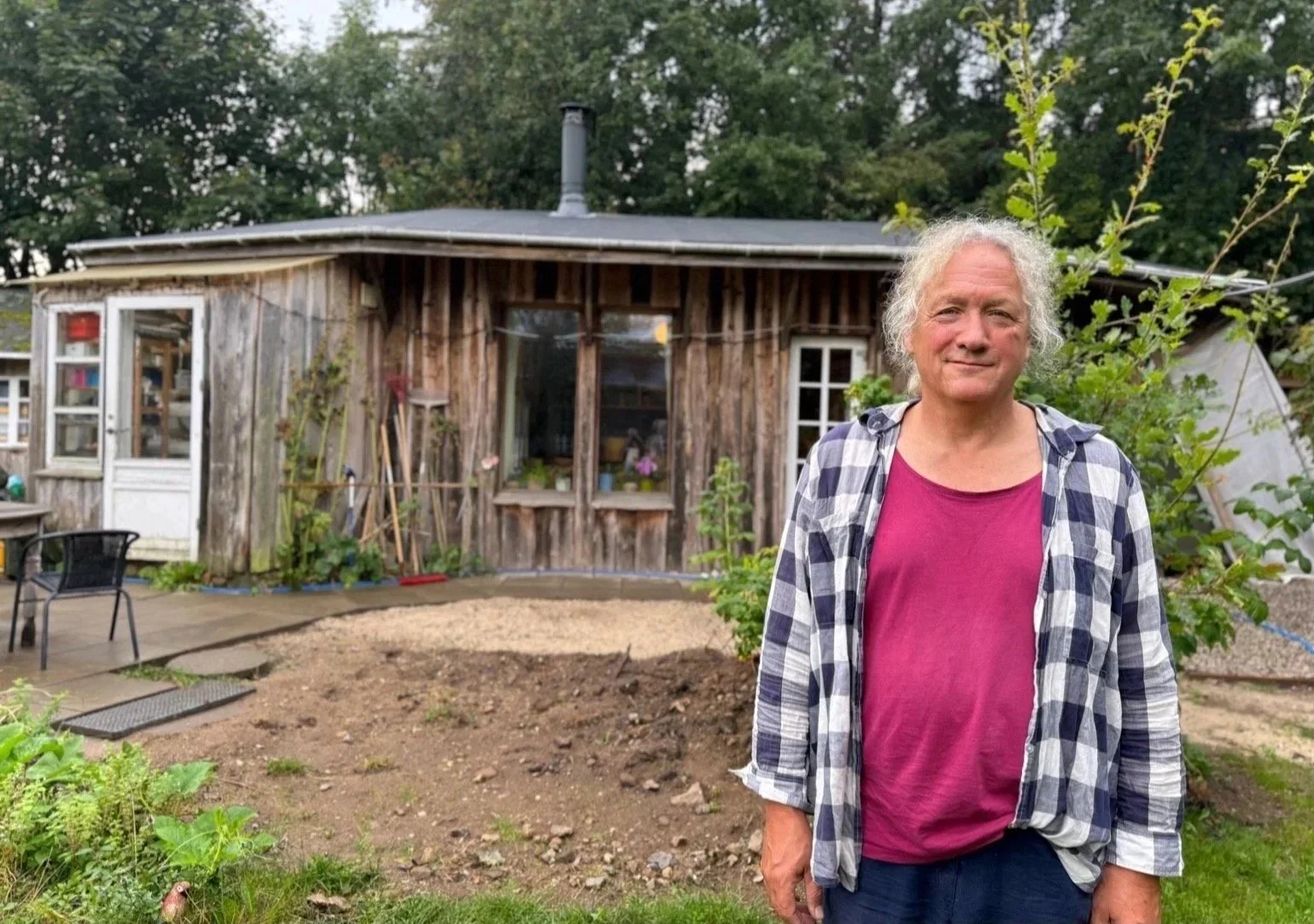 Alan Pauel (Denmark)
Friland, Denmark.  

Standing in front of his humble cob house, Alan Pauel is content. Having served as president and board member to the Danish Ecovillage Network, LØS, he is a proud advocate of ecovillage life and Danish cultur