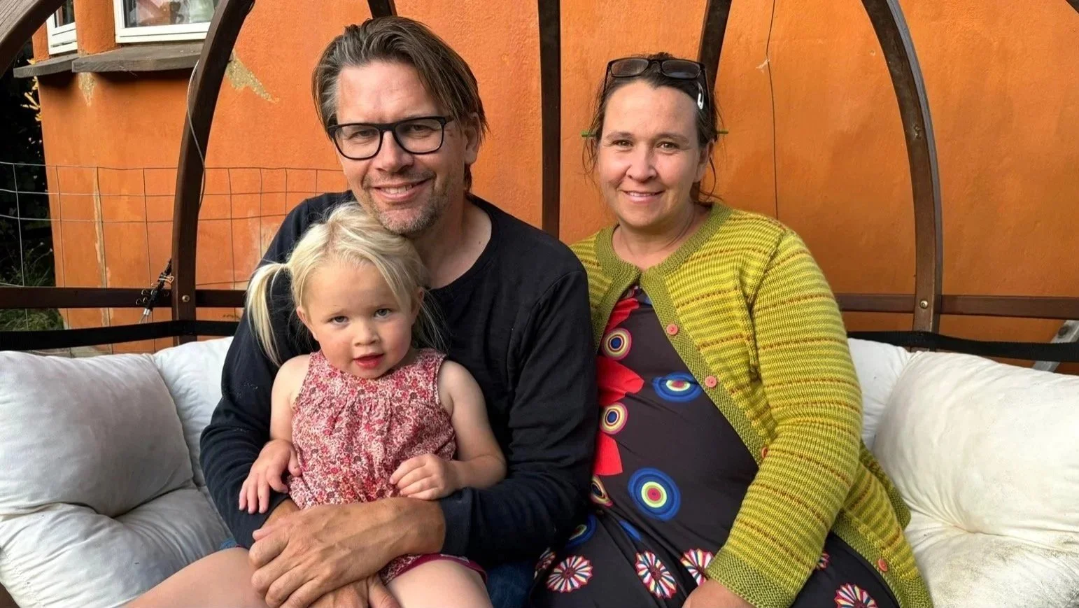 Nikolaj, Laila, and Sigrid (3) (Denmark)
Friland, Denmark.  

Nicolaj and Laila moved to Friland ecosociety in 2016 to build their dream – a straw bale home. As teachers, they love sharing their experience with the many people intrigued with this typ