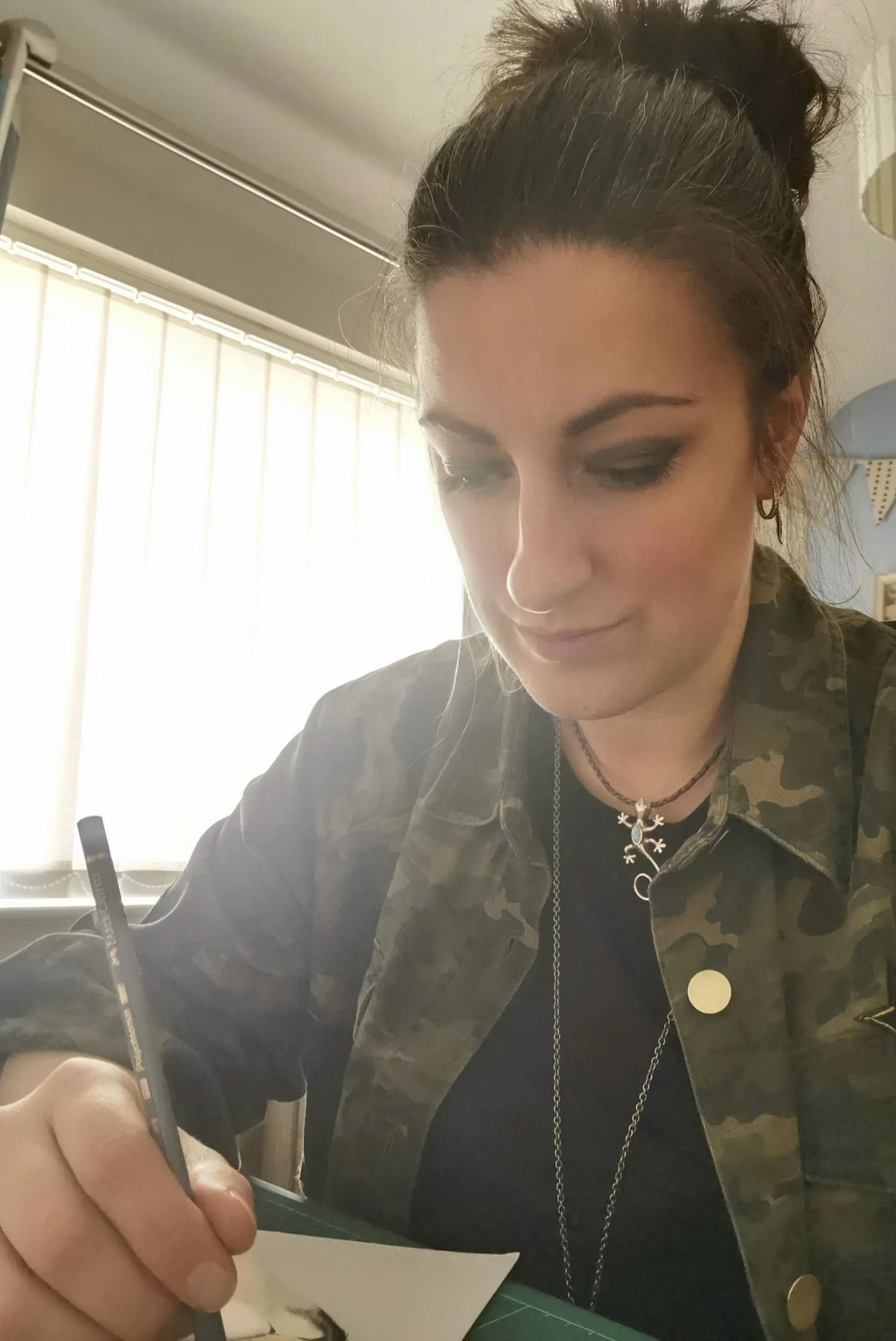 An artist drawing in her studio