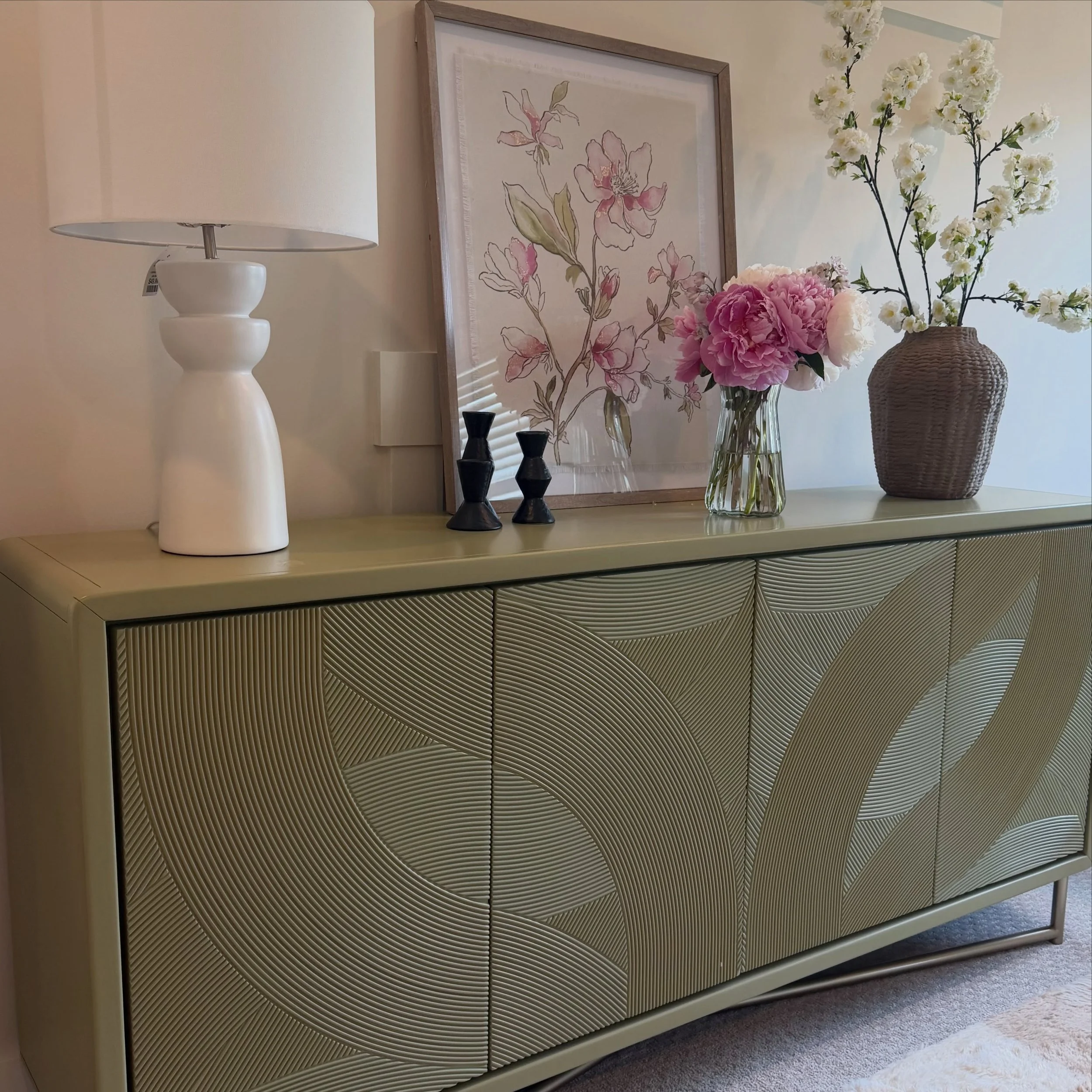 A beautiful space doesn&rsquo;t just photograph well, it changes the way you show up every day. For this home office, I sourced pieces that balance function and beauty: a statement credenza, soft florals, layered textures, and thoughtful styling to c