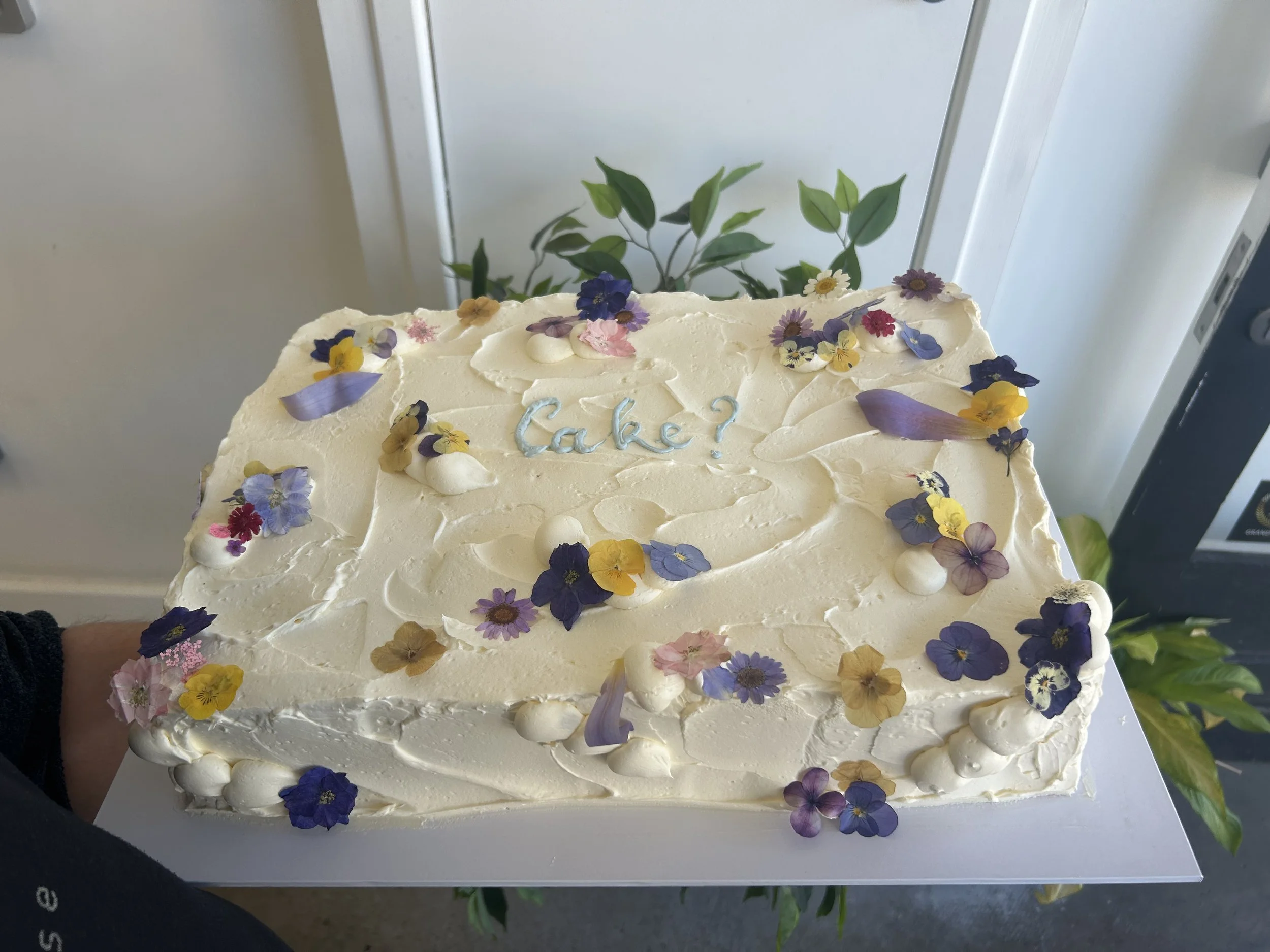 sheet with _messy_ piping and fresh florals.jpeg