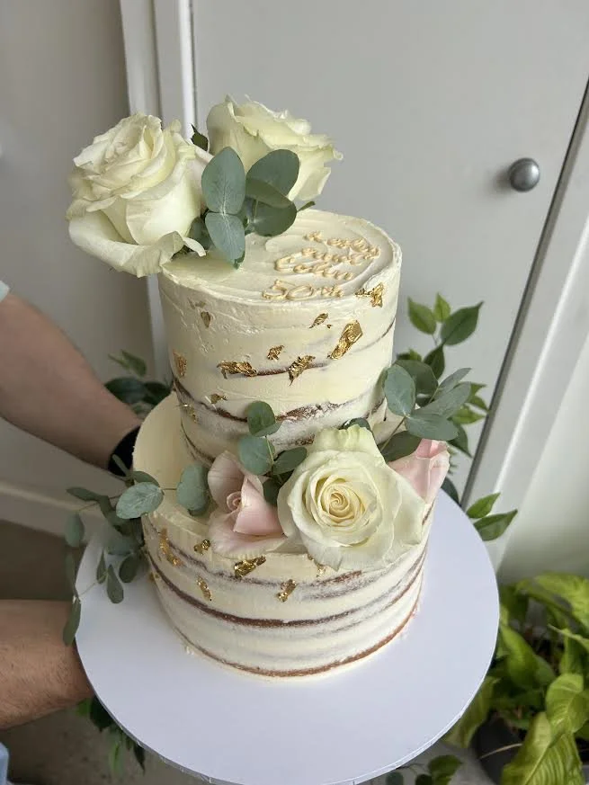 2 tier semi-naked with fresh florals and gold leaf.jpg