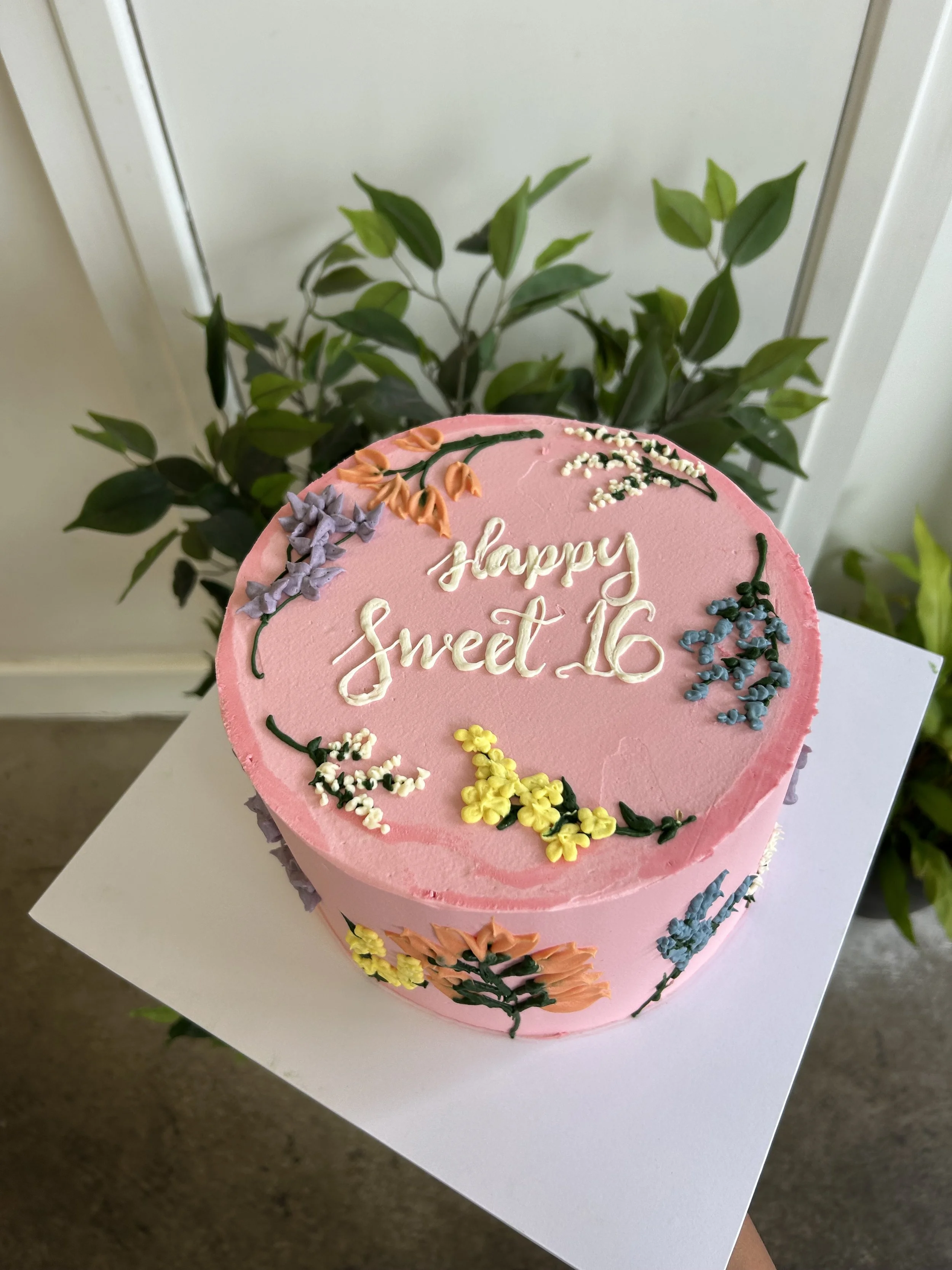 piped floral design with message.jpeg