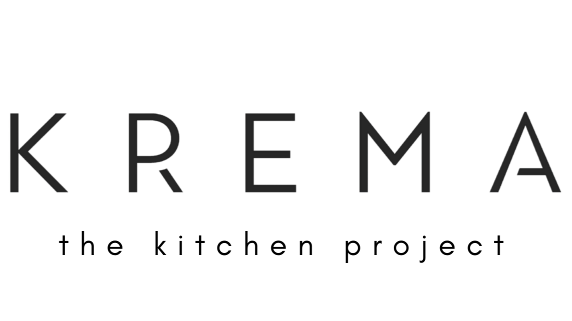 Black text spelling 'KREMA' with smoky effect on a black background.