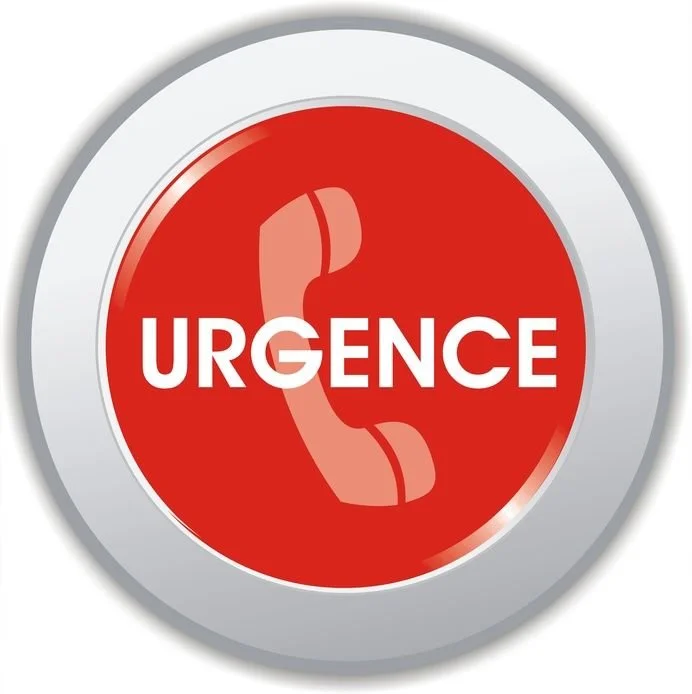 Bouton rouge avec l'inscription 'Urgence' et un symbole de téléphone